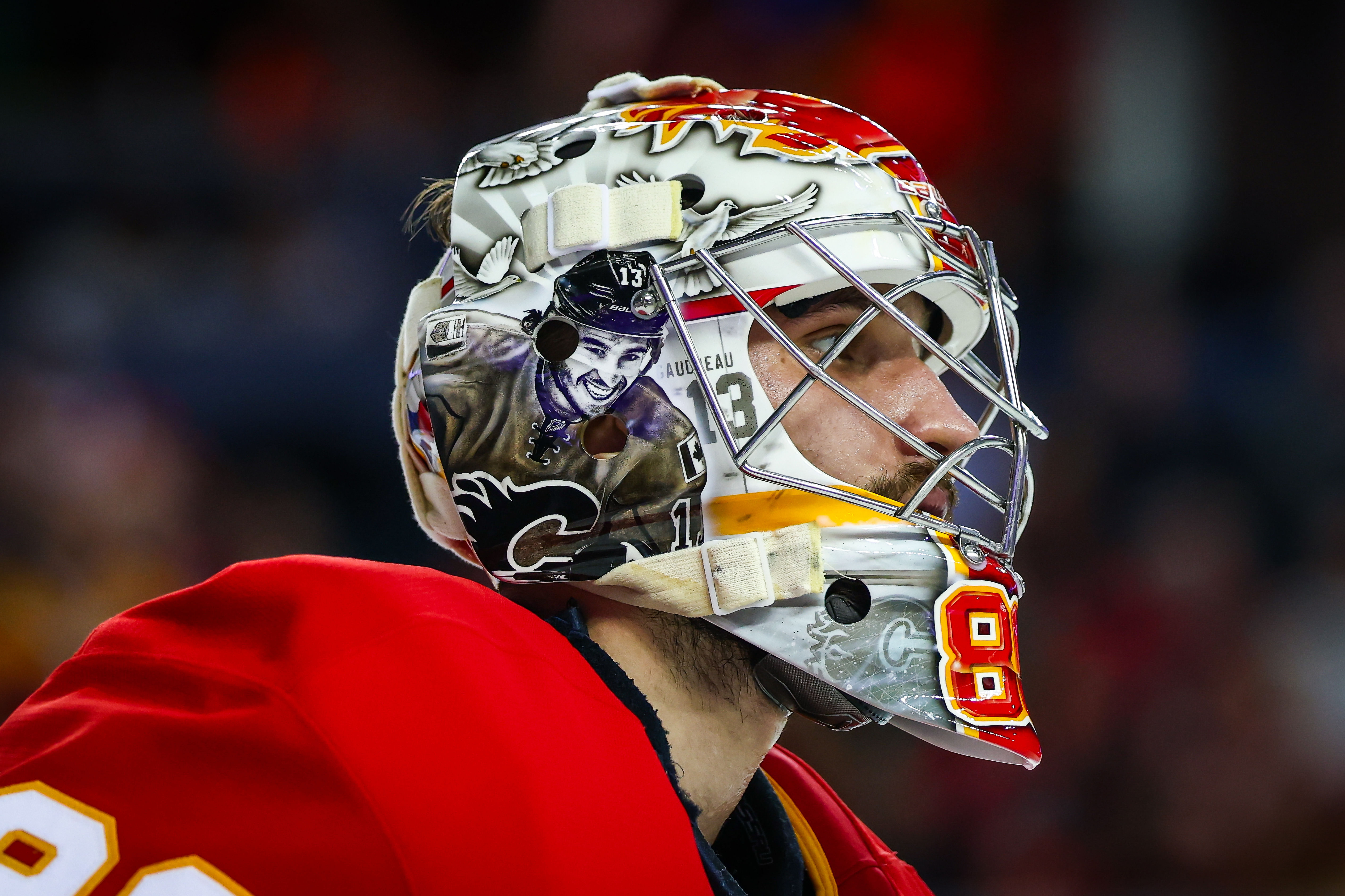 Calgary Flames goaltender Dan Vladar (80) pays tribute to the late Johnny Gaudreau on his mask during the third period against the Columbus Blue Jackets at Scotiabank Saddledome. - Source: Imagn