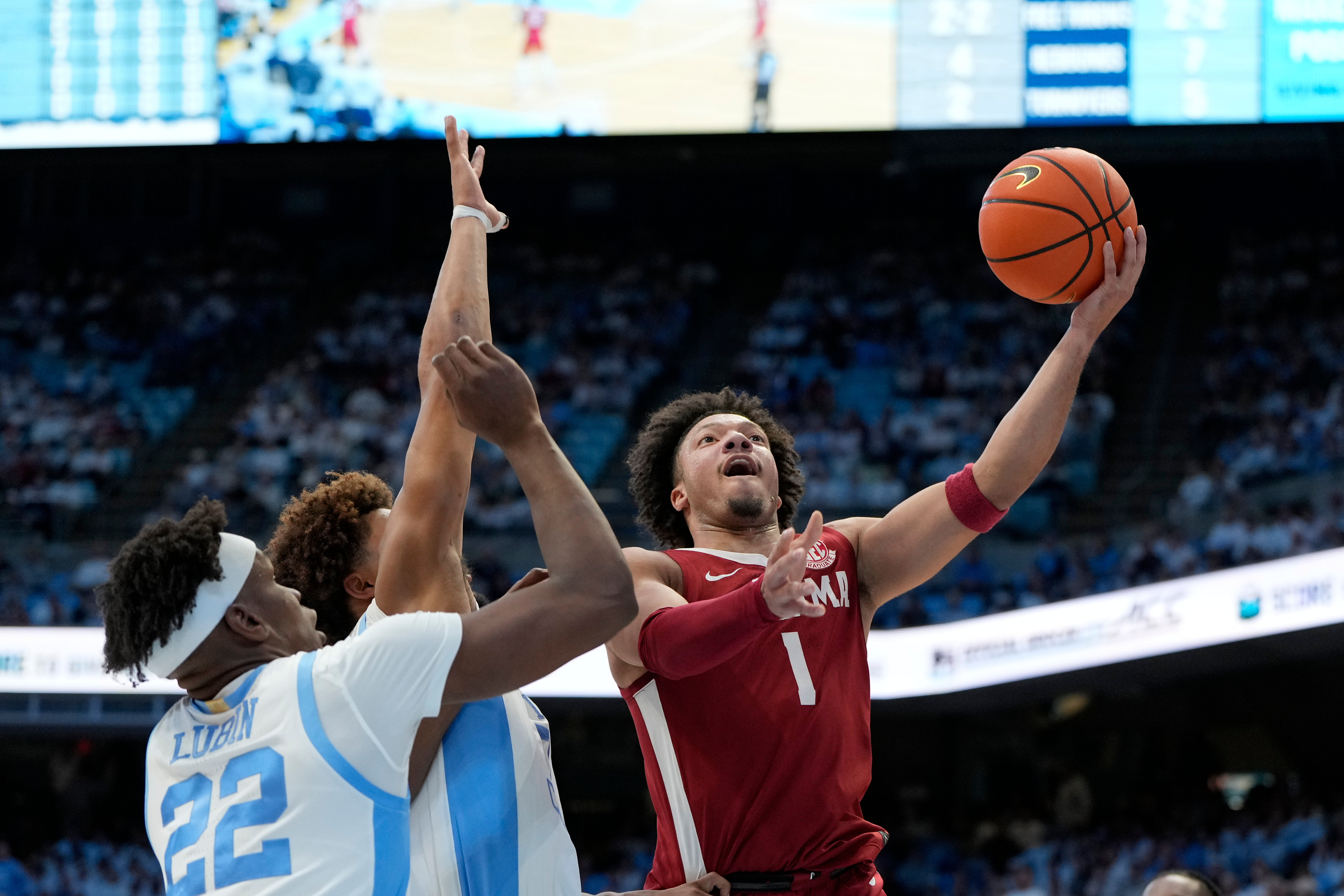 Alabama Crimson Tide guard Mark Sears (1) shoots as North Carolina Tar Heels forward Ven-Allen Lubin (22) and guard Seth Trimble (7) defend in the first half. (Image Source: Imagn)