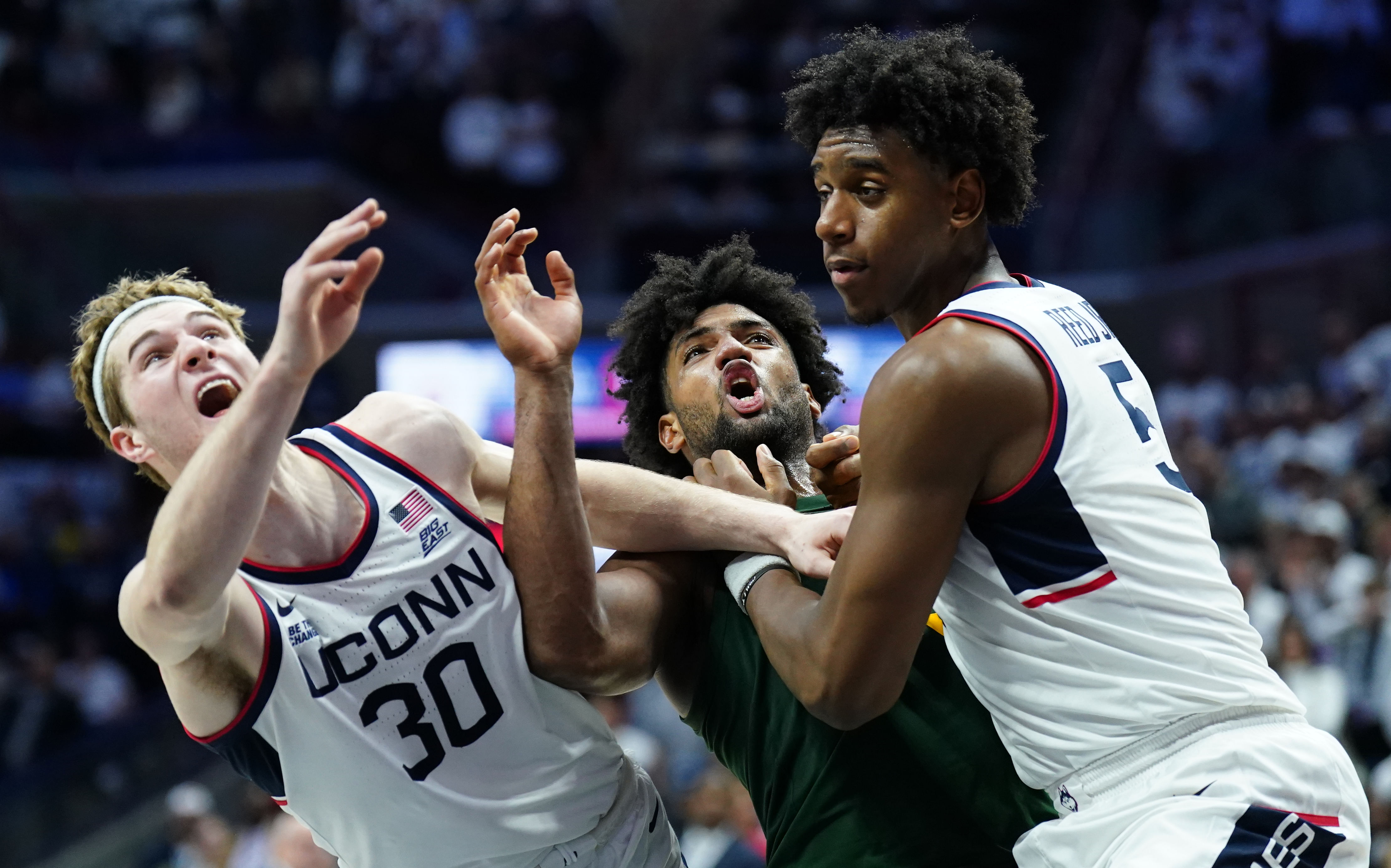 UConn Huskies forward Liam McNeeley (30) and center Tarris Reed Jr. (5) defend against Baylor Bears forward Norchad Omier (15) in the second half at Harry A. Gampel Pavilion. Photo: Imagn