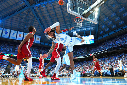 North Carolina Tar Heels guard RJ Davis (4) shoots as Alabama Crimson Tide center Clifford Omoruyi (11) defends in the second half at Dean E. Smith Center. (Image Source: Imagn)