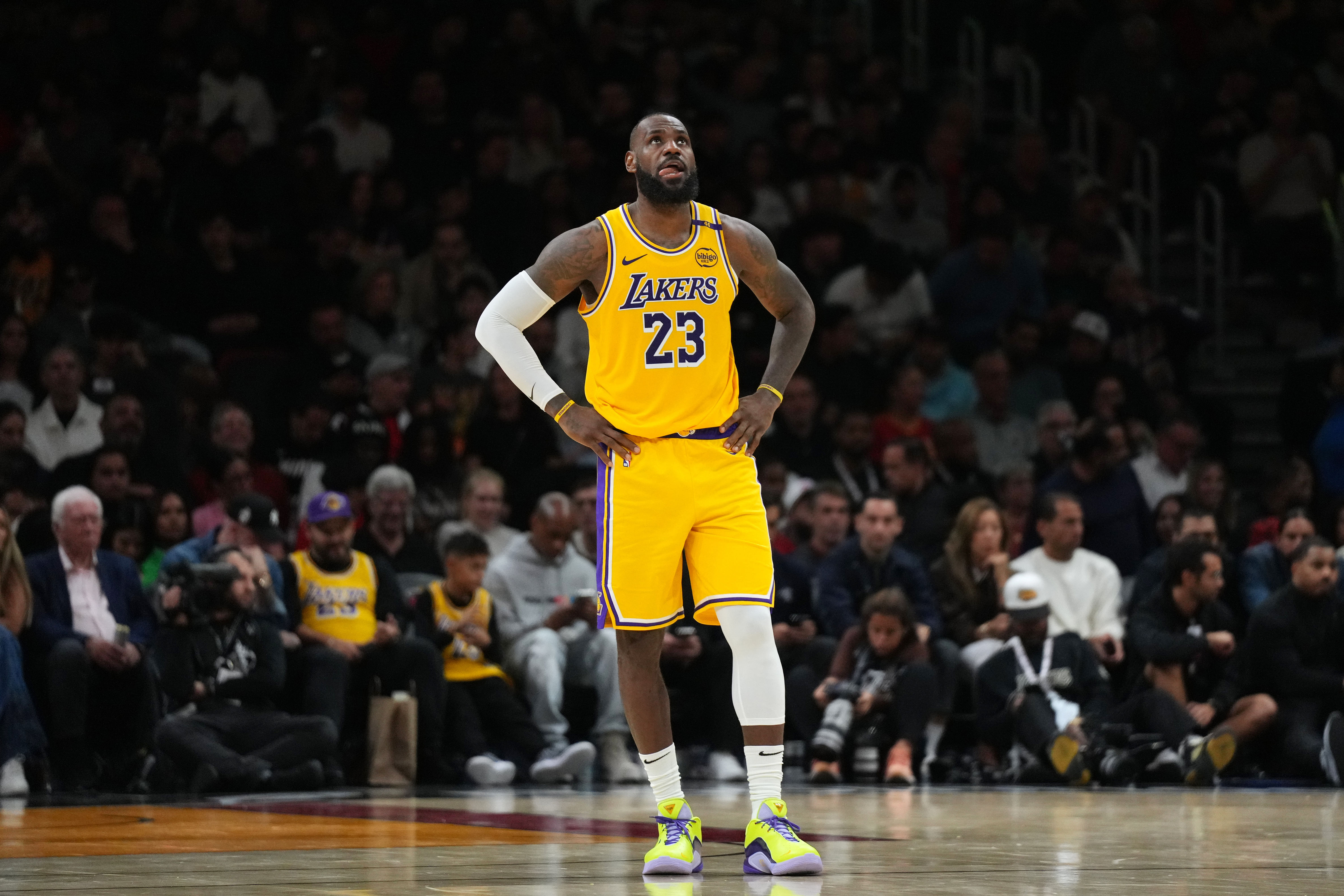 Dec 4, 2024; Miami, Florida, USA; Los Angeles Lakers forward LeBron James (23) looks up at the scoreboard late in a game against the Miami Heat at Kaseya Center. Mandatory Credit: Jim Rassol-Imagn Images - Source: Imagn