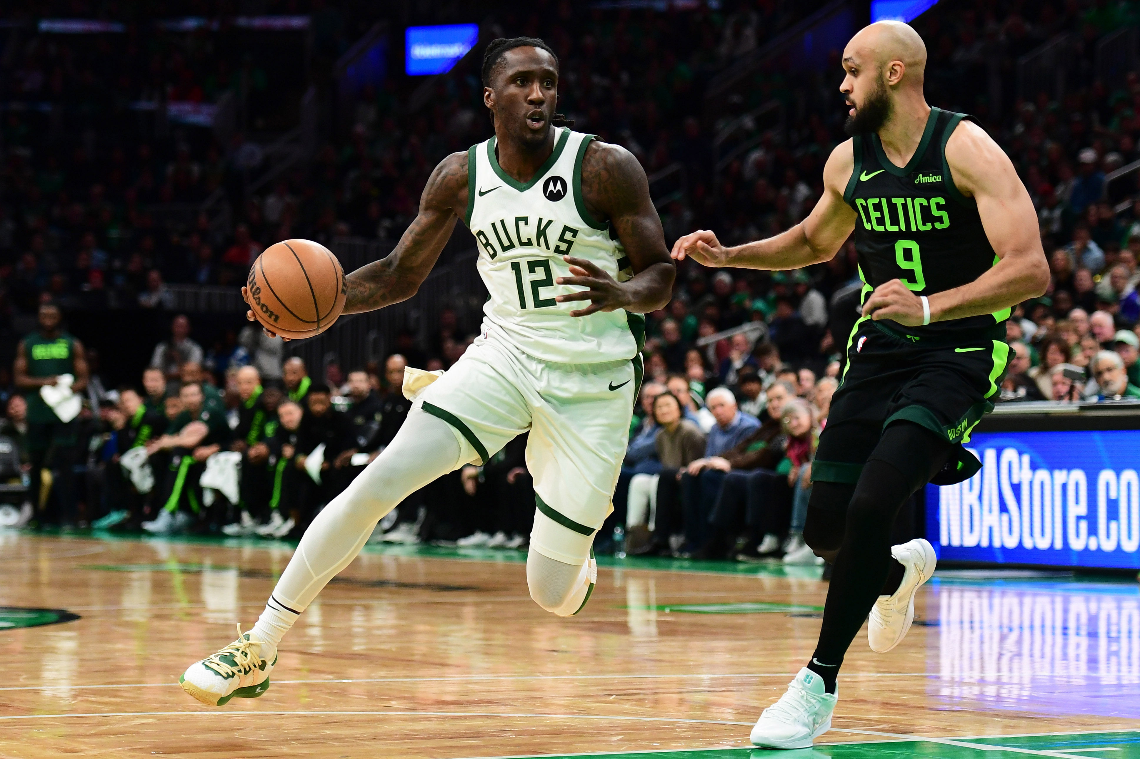 Milwaukee Bucks forward Taurean Prince (12) controls the ball while Boston Celtics guard Derrick White (9) defends - Source: Imagn