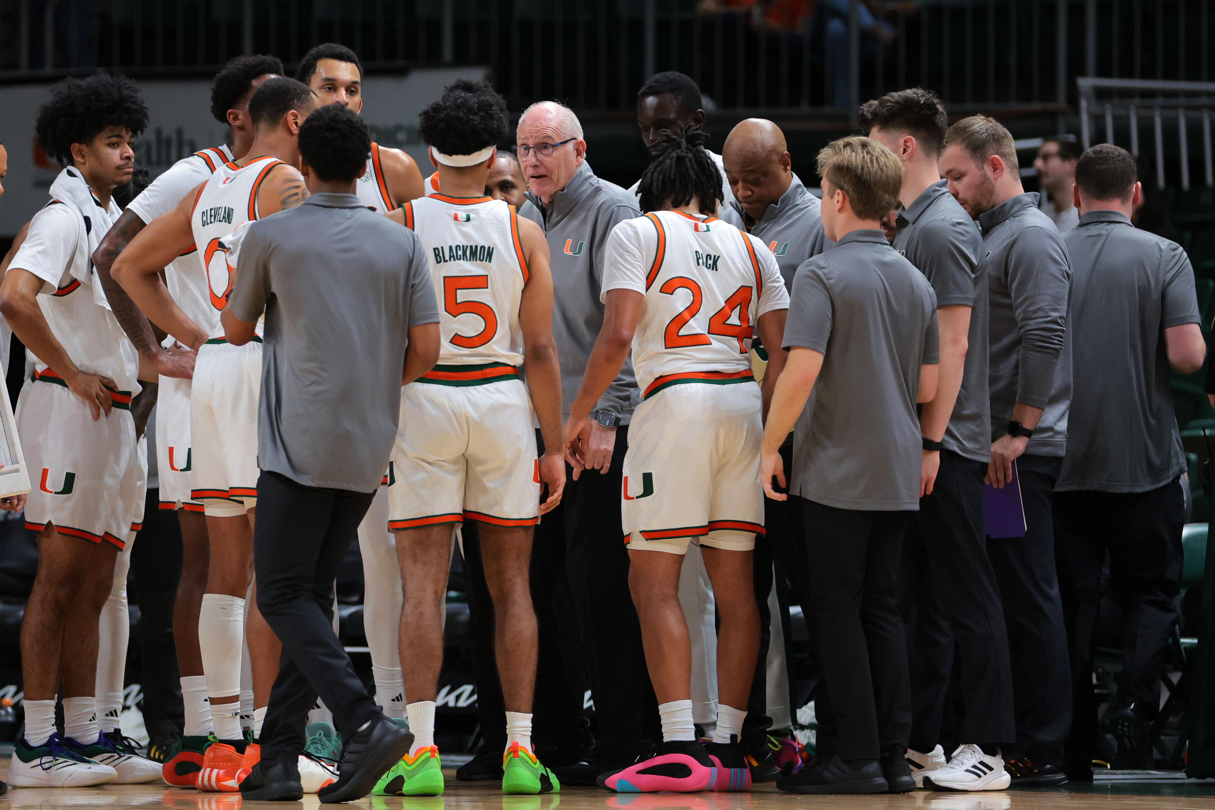 Dec 7, 2024; Coral Gables, Florida, USA; Miami Hurricanes head coach Jim Larranaga talks to his players during a timeline against the Clemson Tigers- Source: Imagn