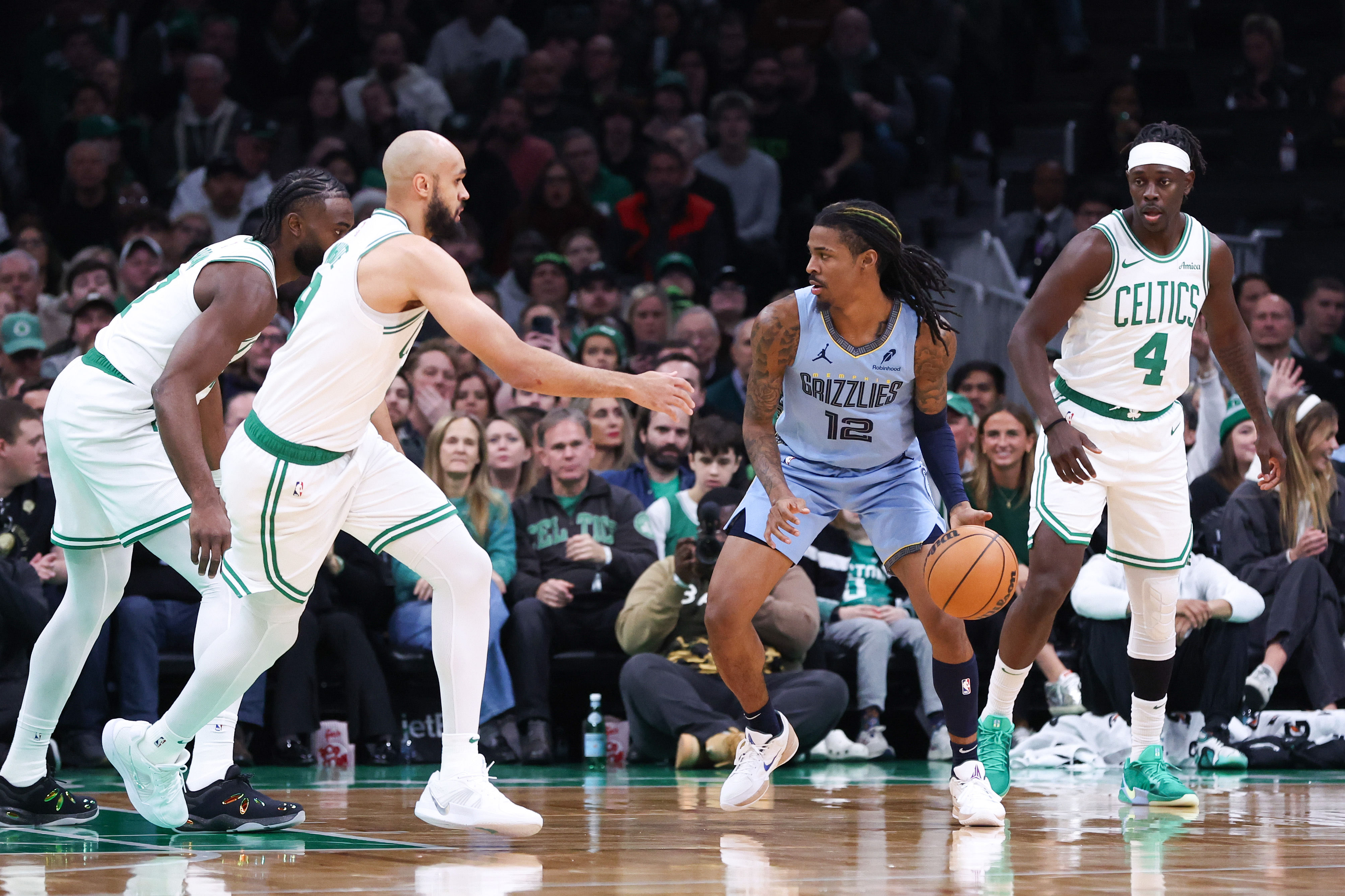 Memphis Grizzlies guard Morant (12) dribbles down the court during the first half against the Boston Celtics at TD Garden. - Source: Imagn