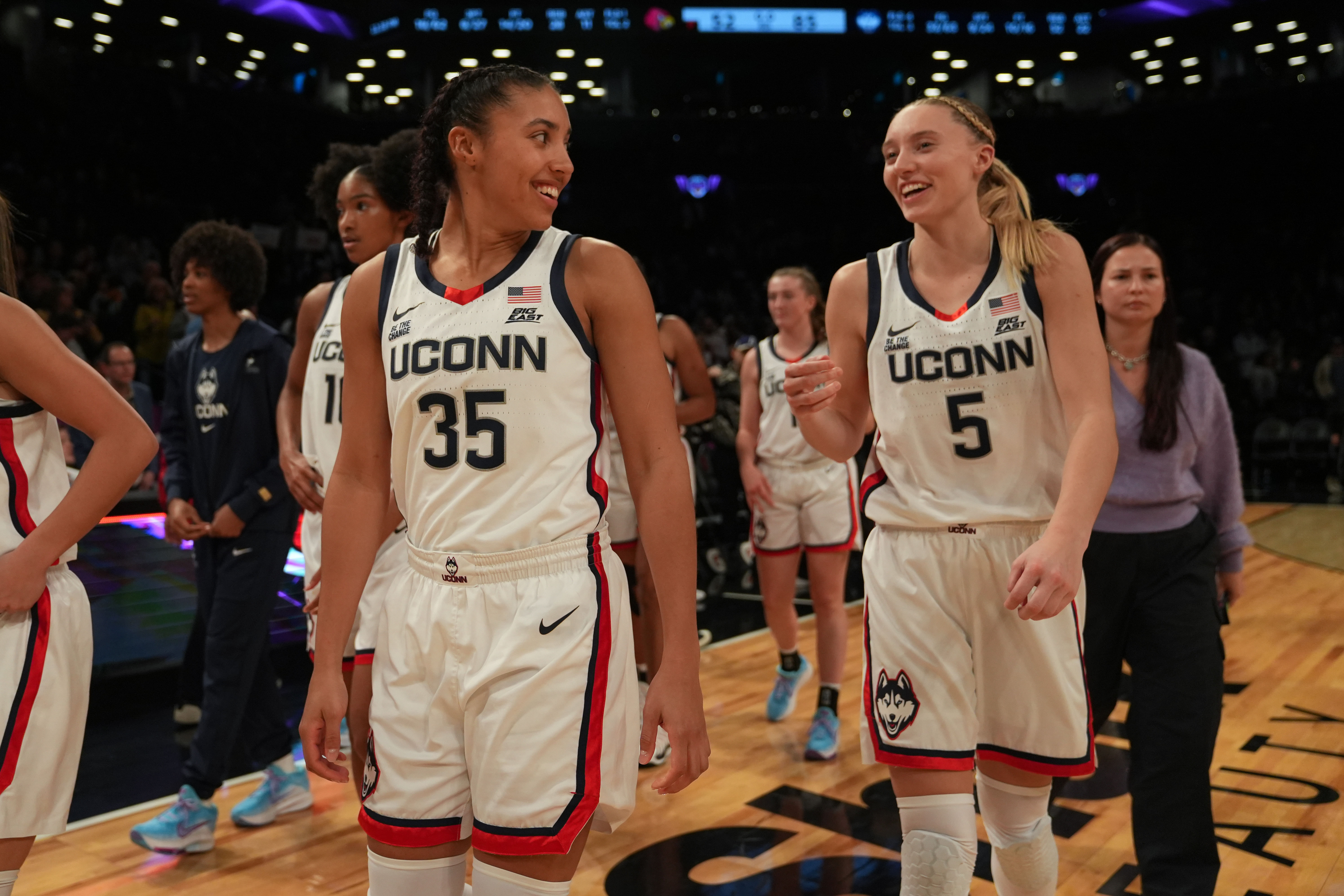 Connecticut Huskies guard Azzi Fudd (#35) and Connecticut Huskies guard Paige Bueckers (#5) celebrate after their win against the Louisville Cardinals at Barclays Center in Brooklyn, New York. Photo: Imagn