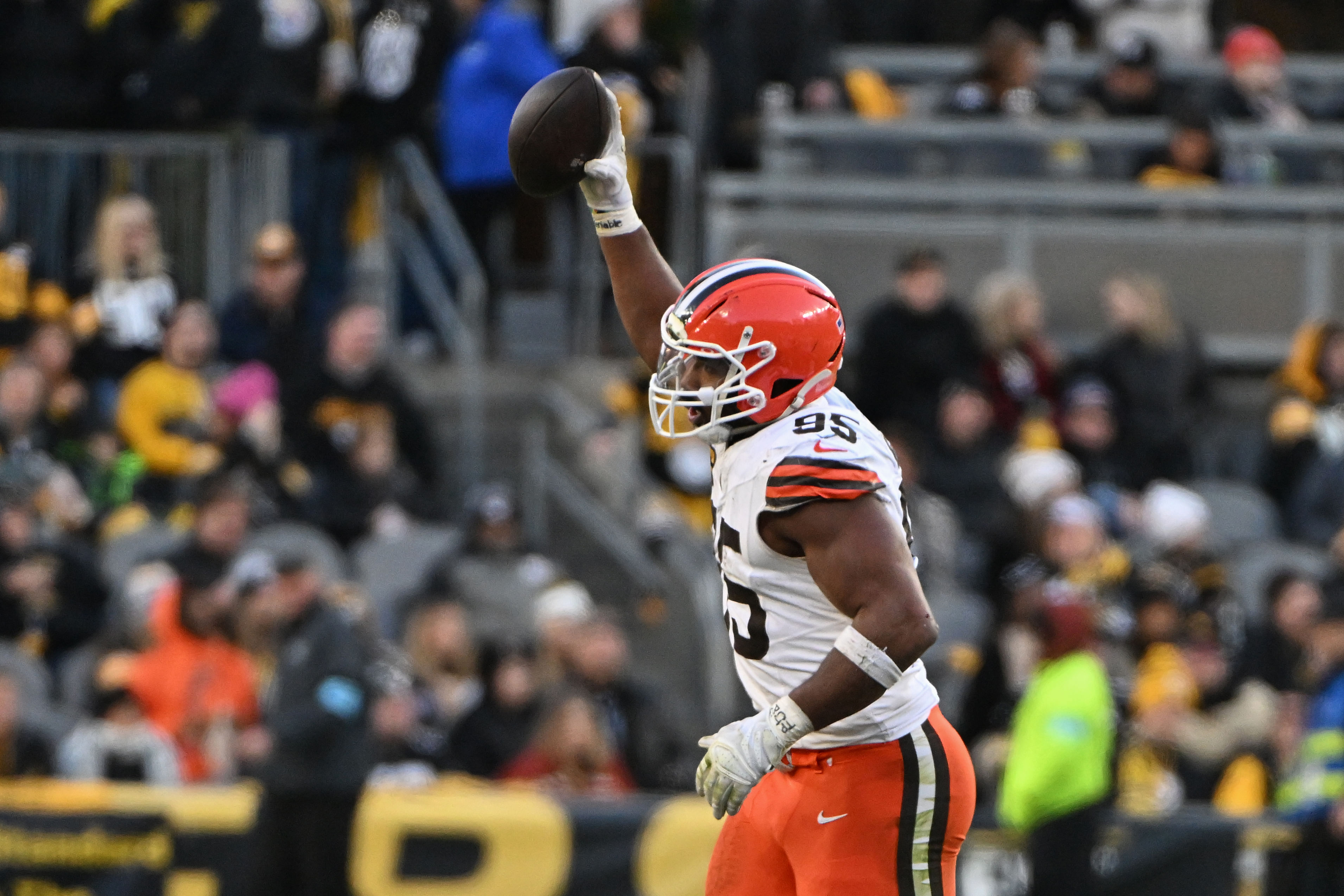 Cleveland Browns defensive end Myles Garrett (95) celebrates a fumble recovery during an NFL game. (Credits: IMAGN)