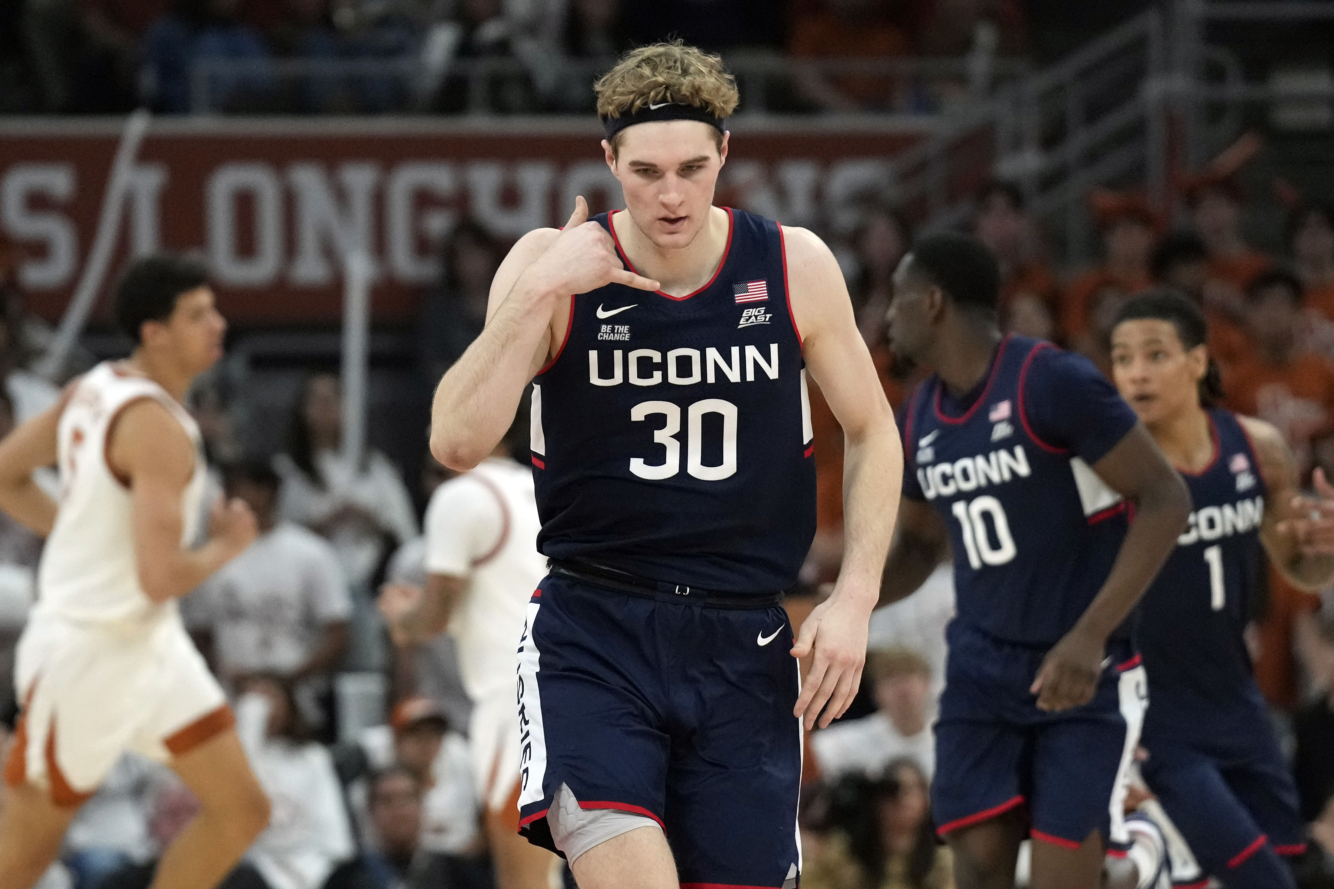 Connecticut Huskies forward Liam McNeeley (30) reacts after scoring a three-point basket during the first half against the Texas Longhorns at Moody Center. Photo: Imagn