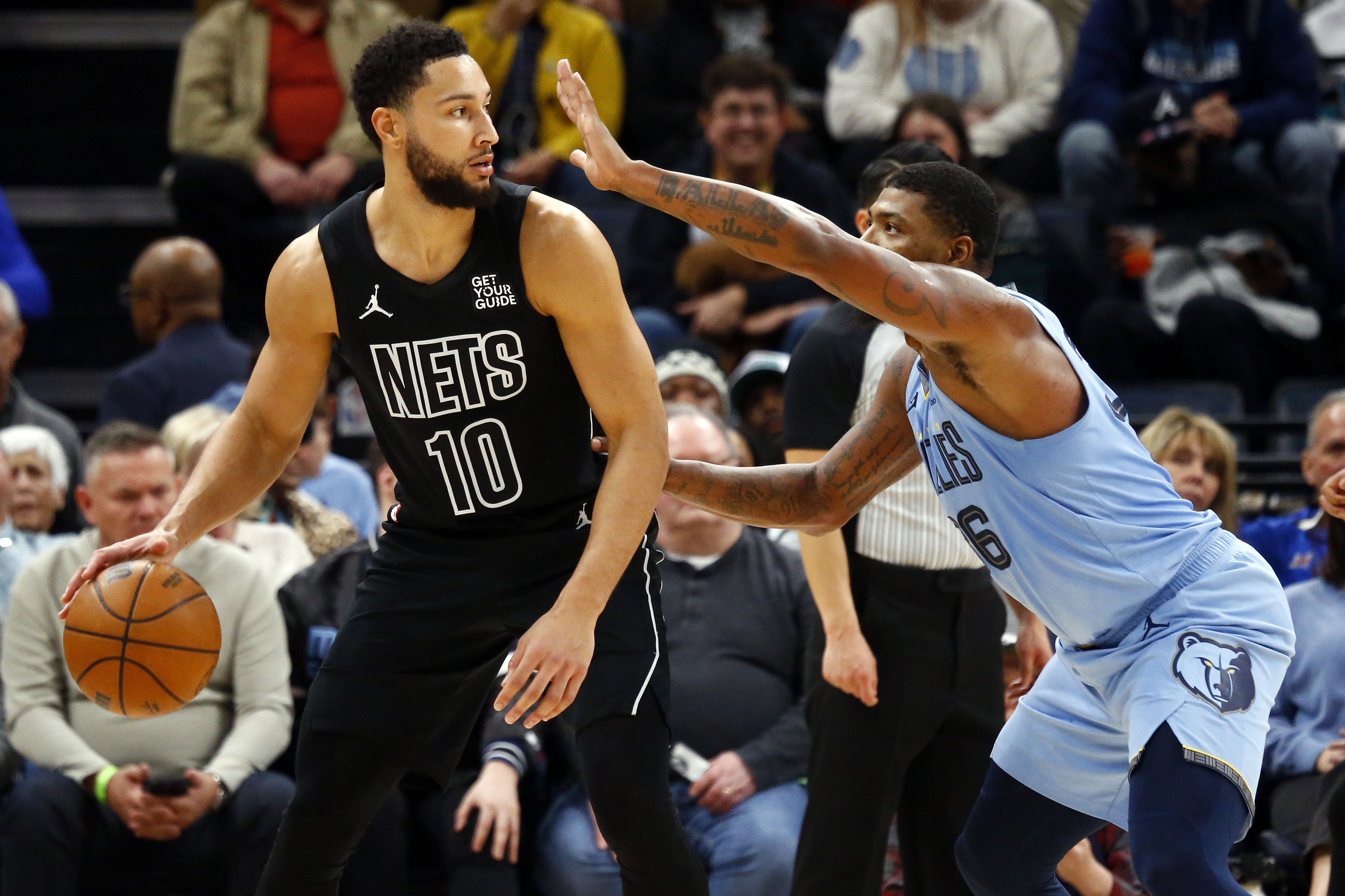 Brooklyn Nets guard Ben Simmons dribbles as Memphis Grizzlies guard Marcus Smart defends at FedExForum. Photo Credit: Imagn