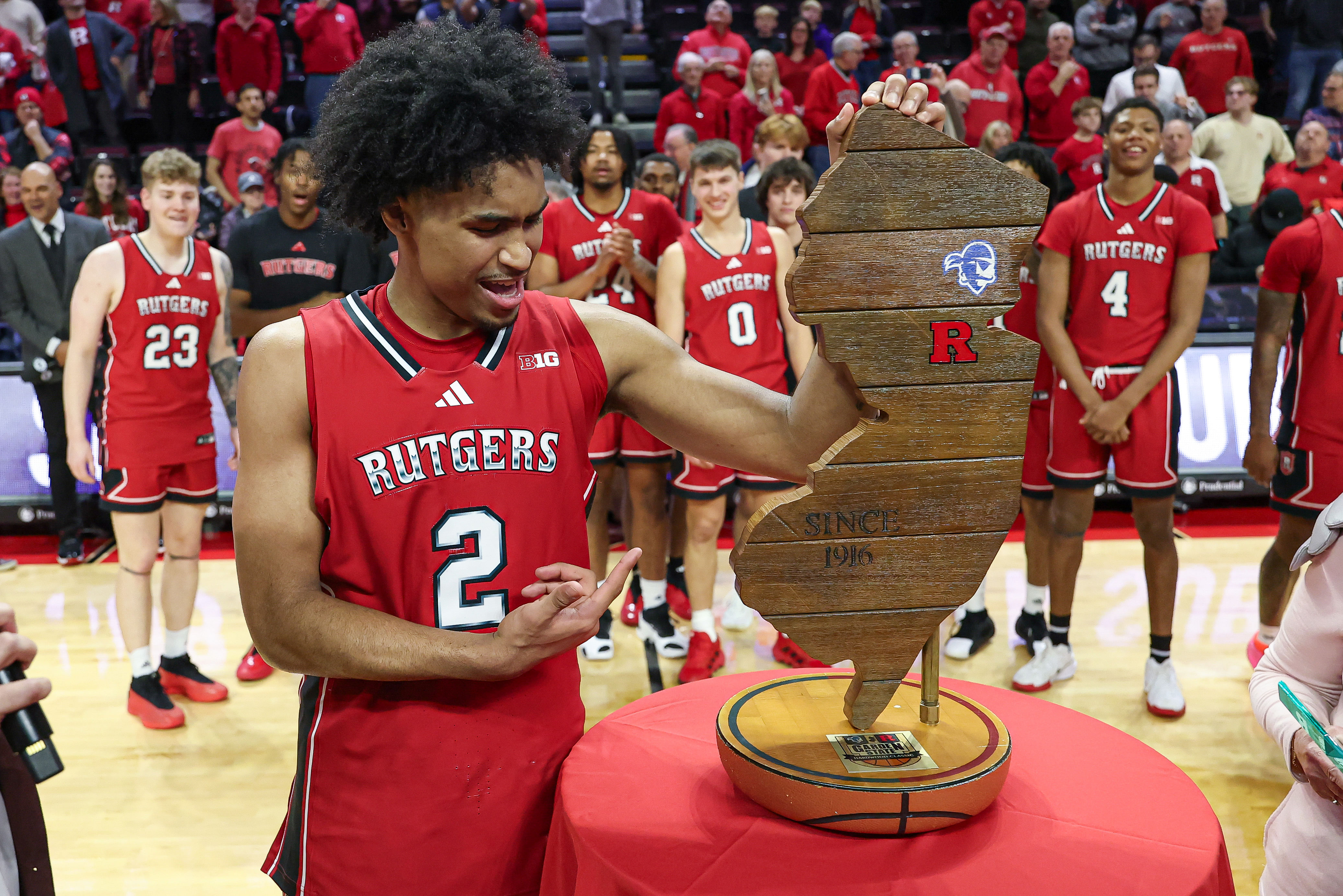 Rutgers guard Dylan Harper (#2) celebrates with the Garden State Hardwood Classic trophy after the Scarlet Knights defeated the Seton Hall Pirates at Jersey Mike&#039;s Arena. Photo: Imagn