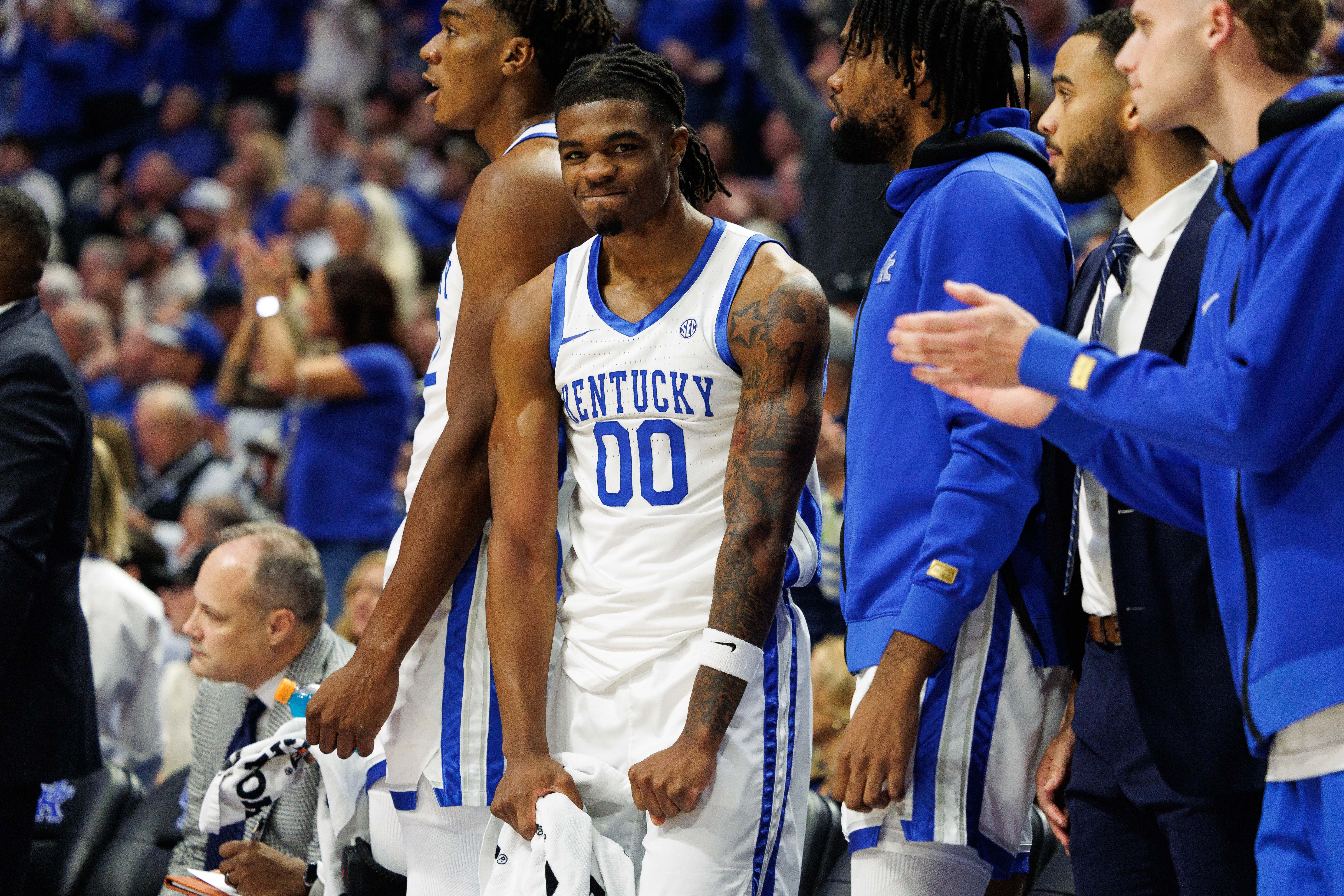 Kentucky Wildcats guard Otega Oweh (#00) celebrates from the bench during the first half against the Louisville Cardinals at Rupp Arena at Central Bank Center. Photo: Imagn