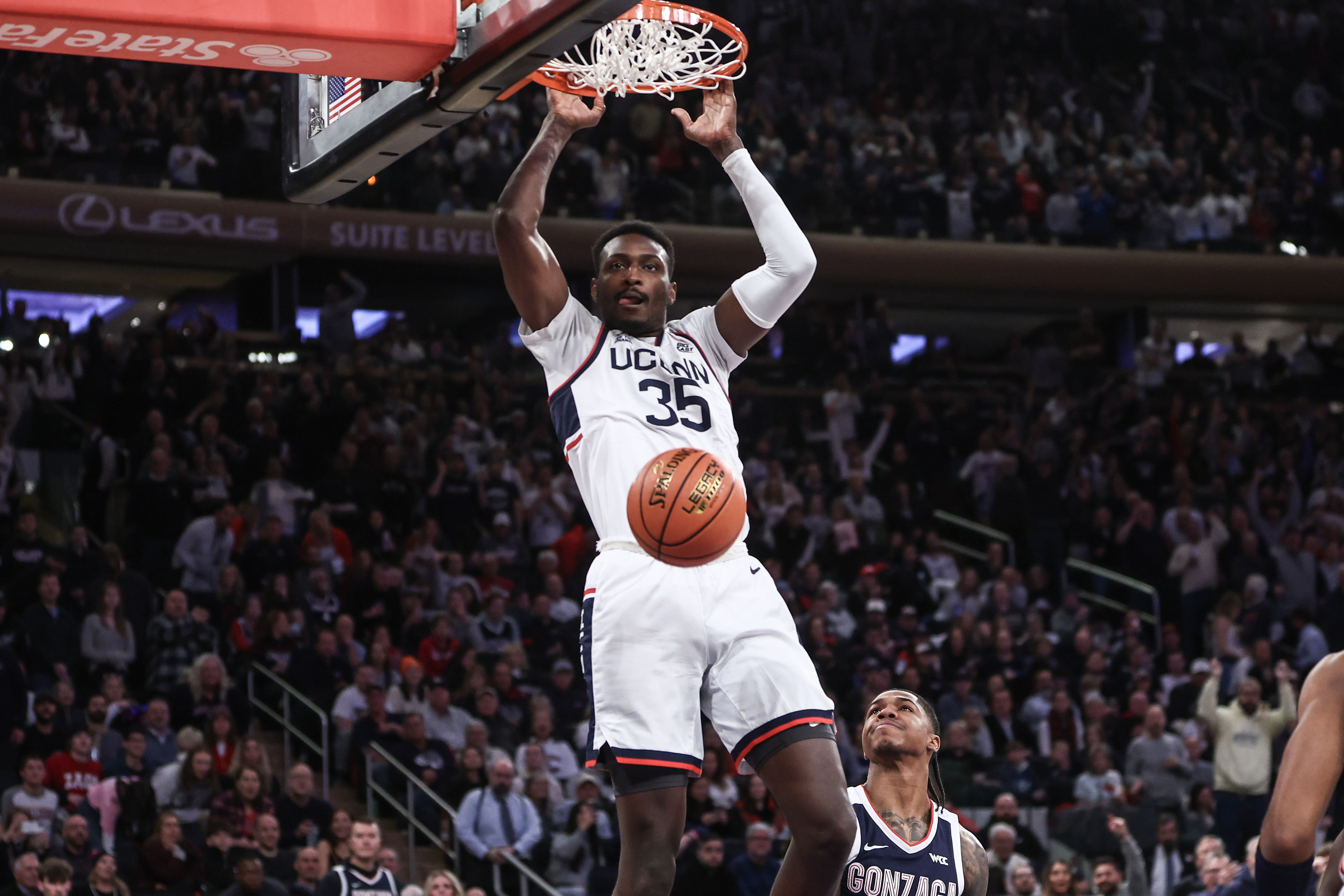 Connecticut Huskies center Samson Johnson (#35) dunks the ball in the first half of their NCAA game against the Gonzaga Bulldogs at Madison Square Garden on December 14, 2024. Photo: Imagn