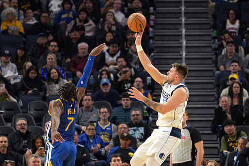 Dallas Mavericks guard Luka Doncic (right) shoots against Golden State Warriors guard Buddy Hield (7) - Source: Imagn