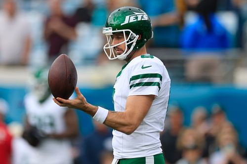 Aaron Rodgers twirls a football (Credits: IMAGN)