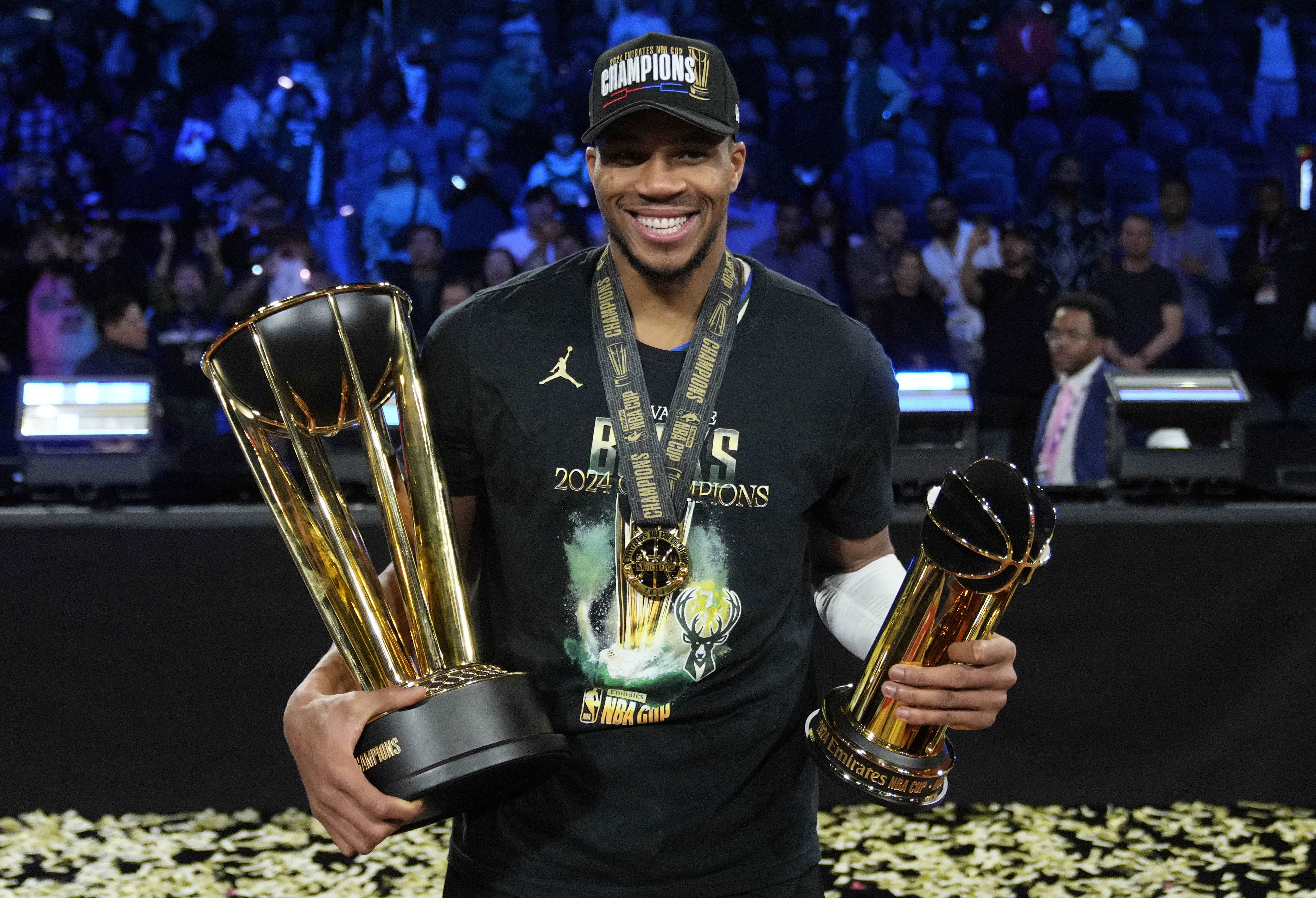 Milwaukee Bucks forward Giannis Antetokounmpo celebrates with the most valuable player and championship trophies at T-Mobile Arena. Photo Credit: Imagn