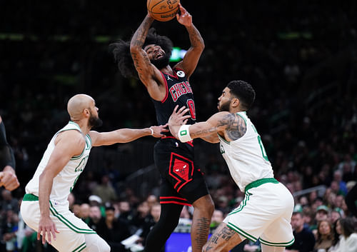 Boston Celtics forward Jayson Tatum (0) and guard Derrick White (9) defend against Chicago Bulls guard Coby White (0) - Source: Imagn