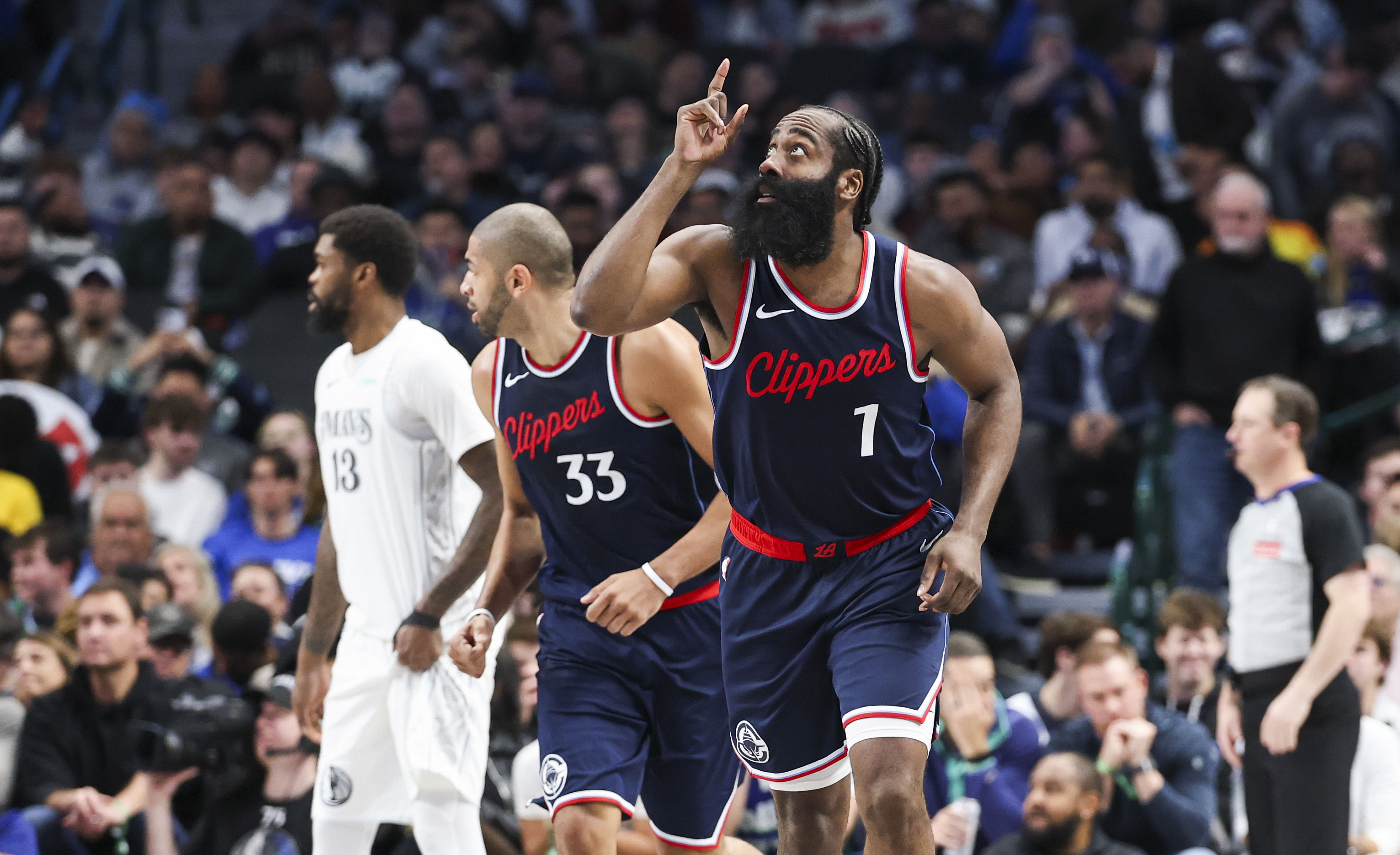 LA Clippers guard James Harden (1) reacts after scoring against the Dallas Mavericks - Source: Imagn