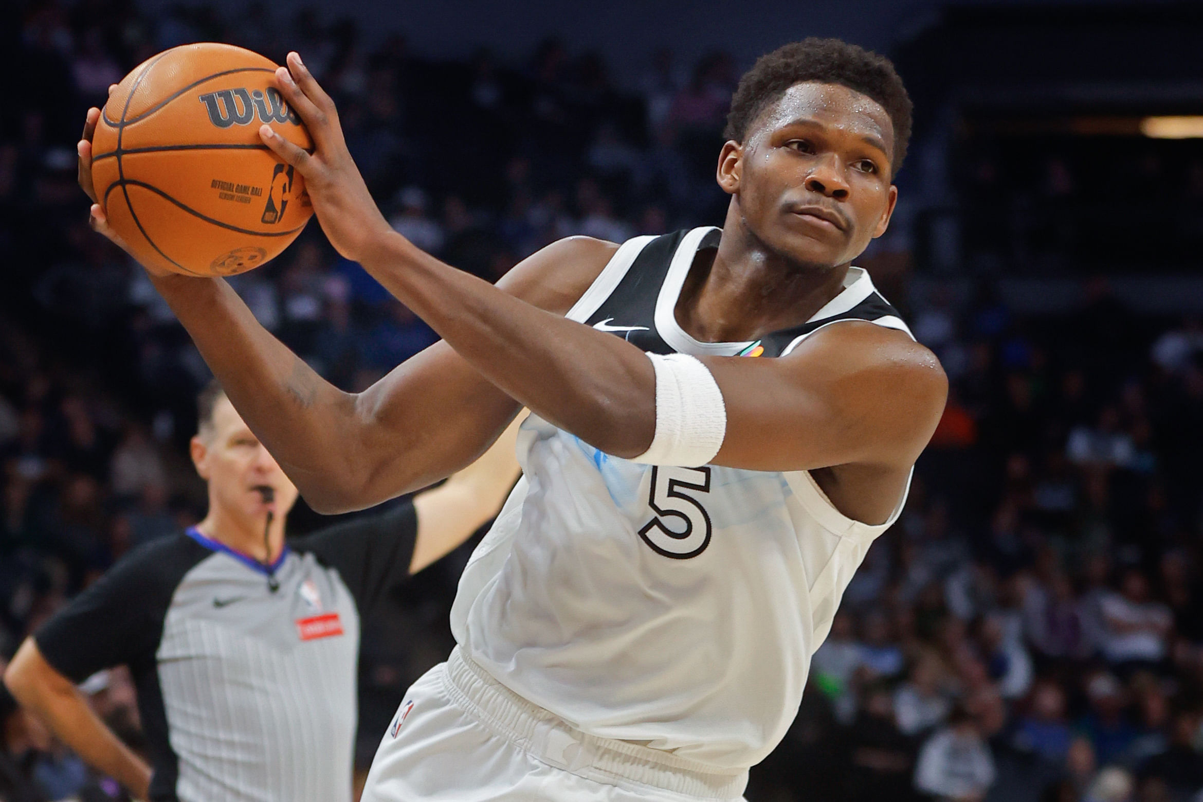 Minnesota Timberwolves guard Anthony Edwards (5) brings the ball upcourt against the New York Knicks in the fourth quarter at Target Center. Mandatory Credit: Bruce Kluckhohn-Imagn Images Imagn