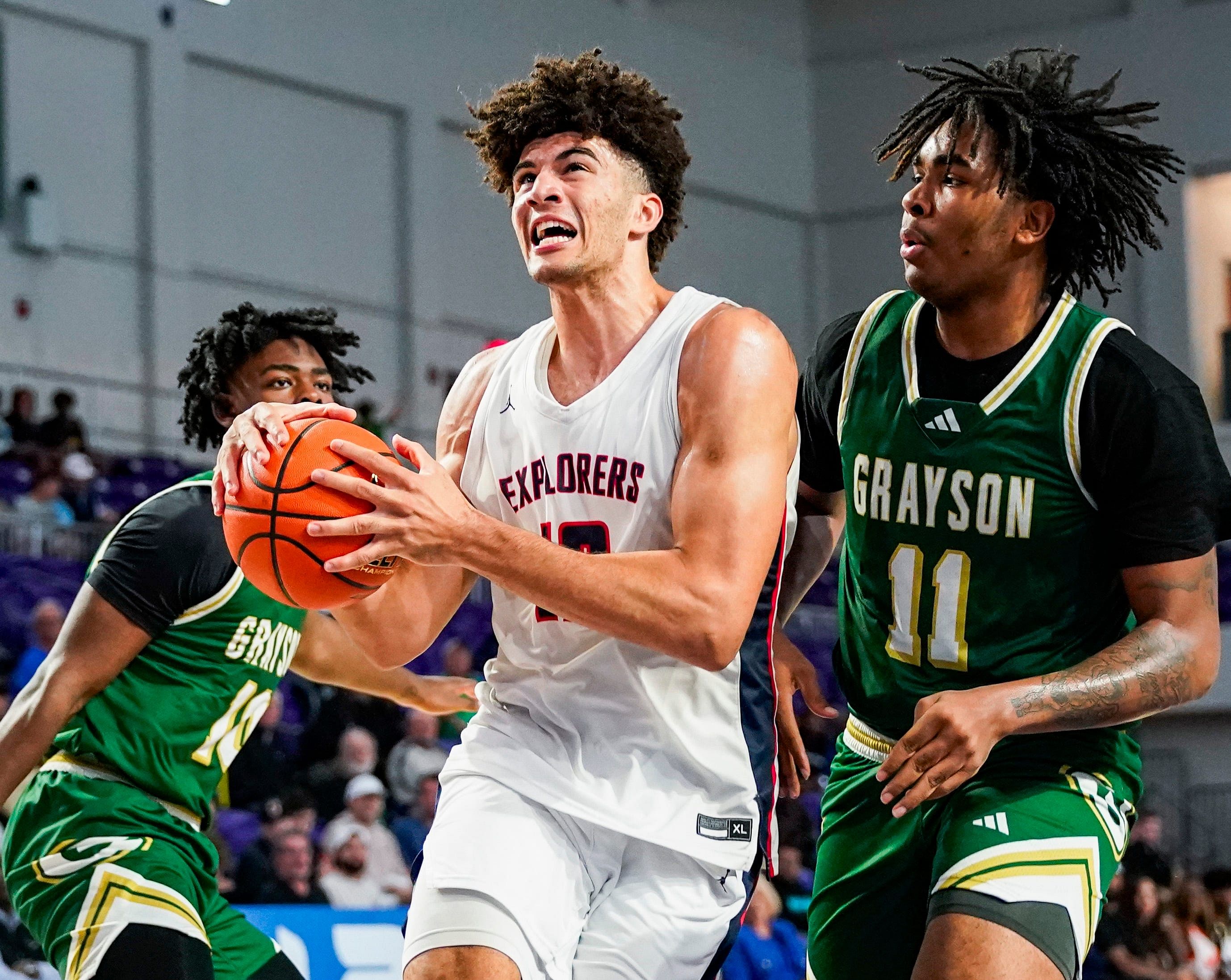 Columbus Explorers forward Cameron Boozer (#12) drives to the basket as Grayson Rams forward Amir Taylor (11) defends him during the third quarter of their City of Palms Classic quarterfinal game at Suncoast Credit Union Arena in Fort Myers, Florida, on Friday, Dec. 20, 2024. Photo: Imagn