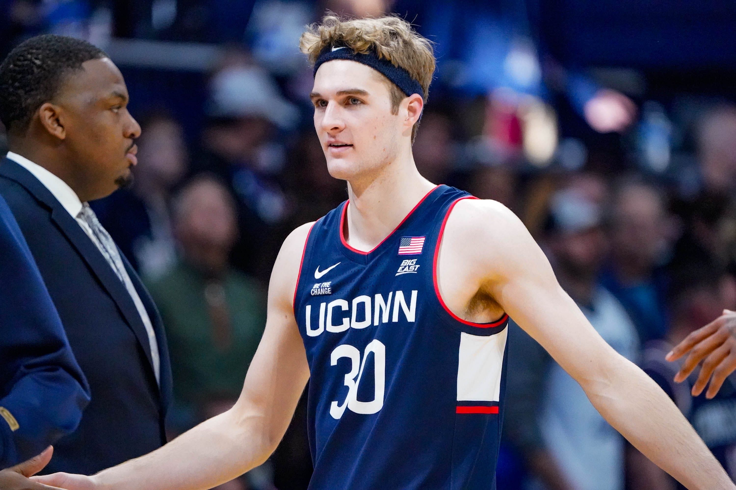 Liam McNeeley (#30) celebrates a basket during the NCAA basketball game between the Butler Bulldogs and the University of Connecticut Huskies at Hinkle Fieldhouse on Saturday, Dec. 21, 2024. Photo: Imagn