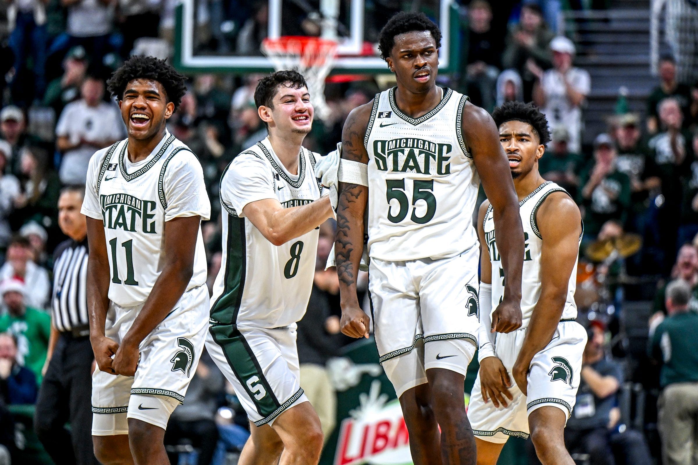 Michigan State&#039;s Coen Carr, center, celebrates with his teammates after scoring a 3-pointer against Florida Atlantic during the second half on Saturday, Dec. 21, 2024, in East Lansing. Photo: Imagn