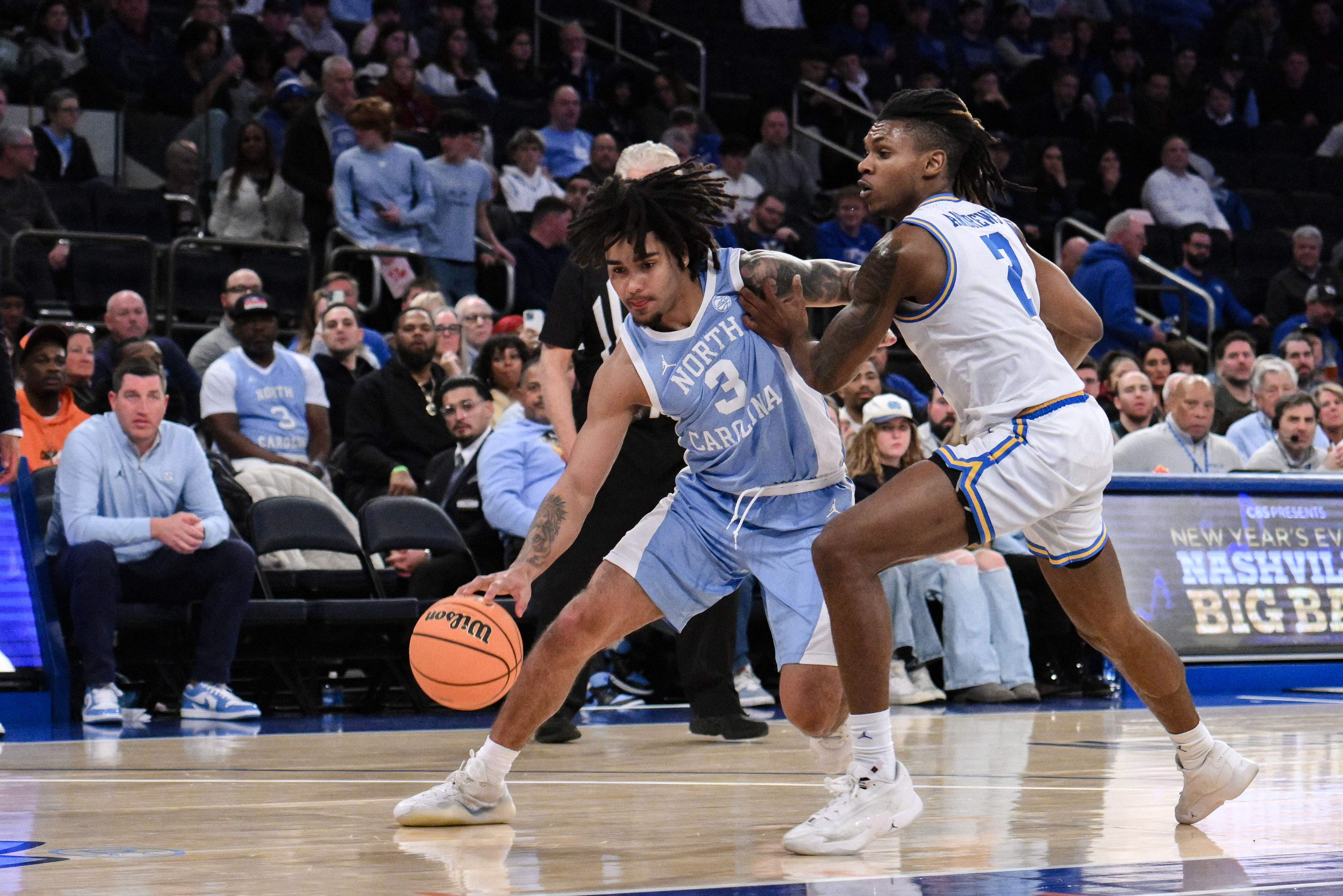 North Carolina Tar Heels guard Elliot Cadeau (#3) drives to the basket while being defended by UCLA Bruins guard Dylan Andrews (#2) during the second half at Madison Square Garden. Photo: Imagn