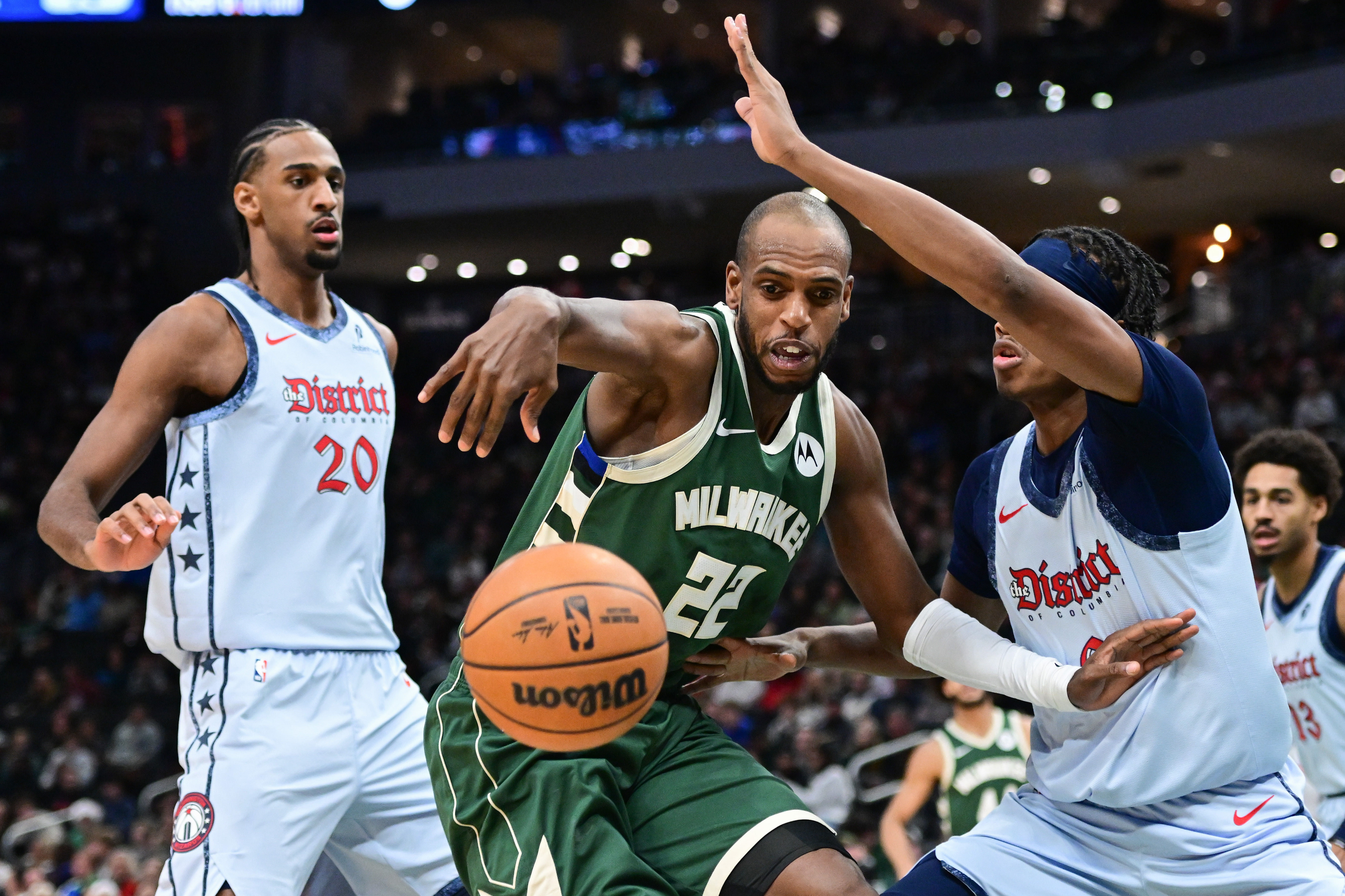 Milwaukee Bucks forward Khris Middleton battles for the ball against Washington Wizards forward Bilal Coulibaly at Fiserv Forum. Photo Credit: Imagn