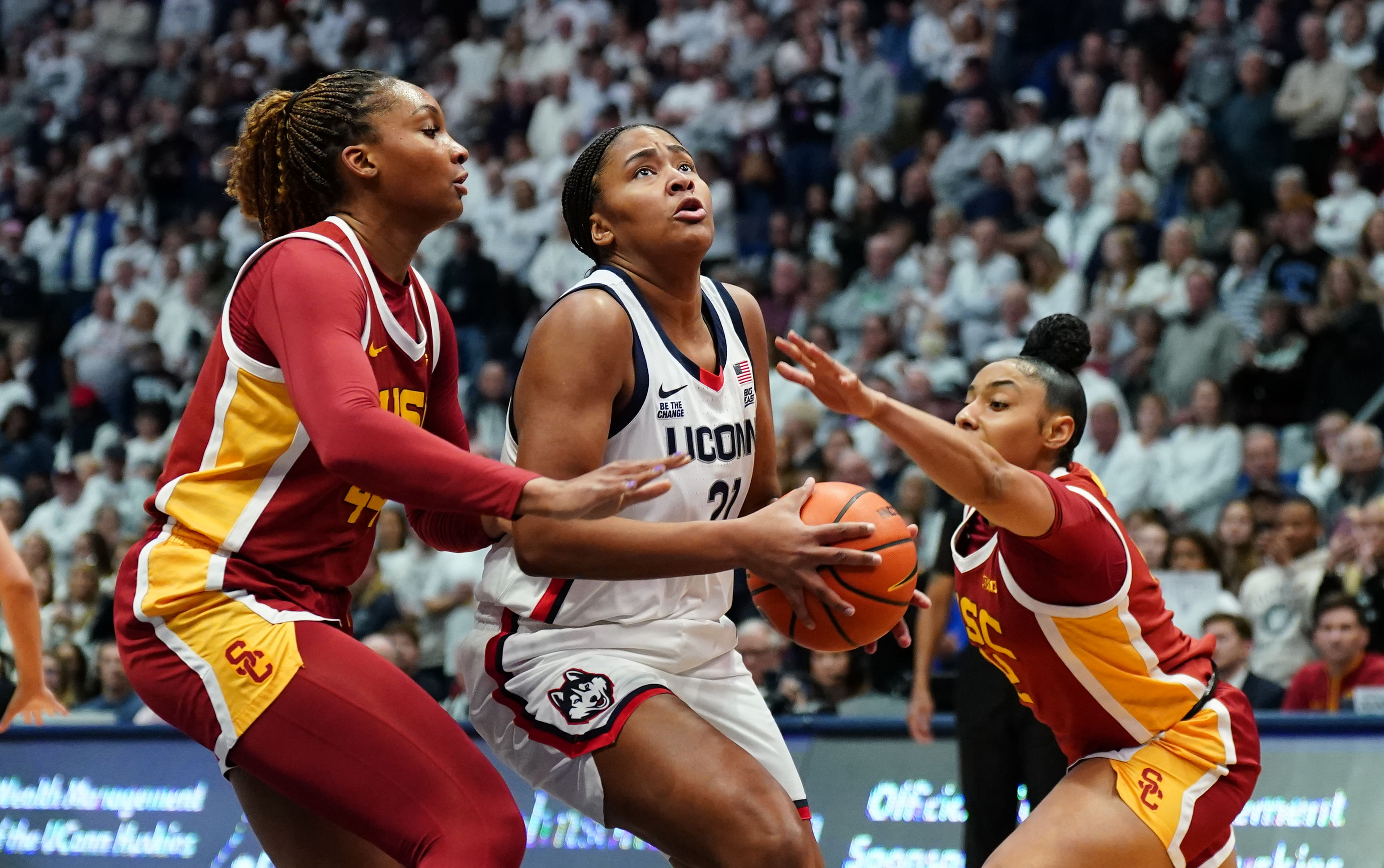 USC Trojans guard JuJu Watkins (#12) and forward Kiki Iriafen (#44) defend against UConn Huskies forward Sarah Strong (#21) in the first half at XL Center. Photo: Imagn