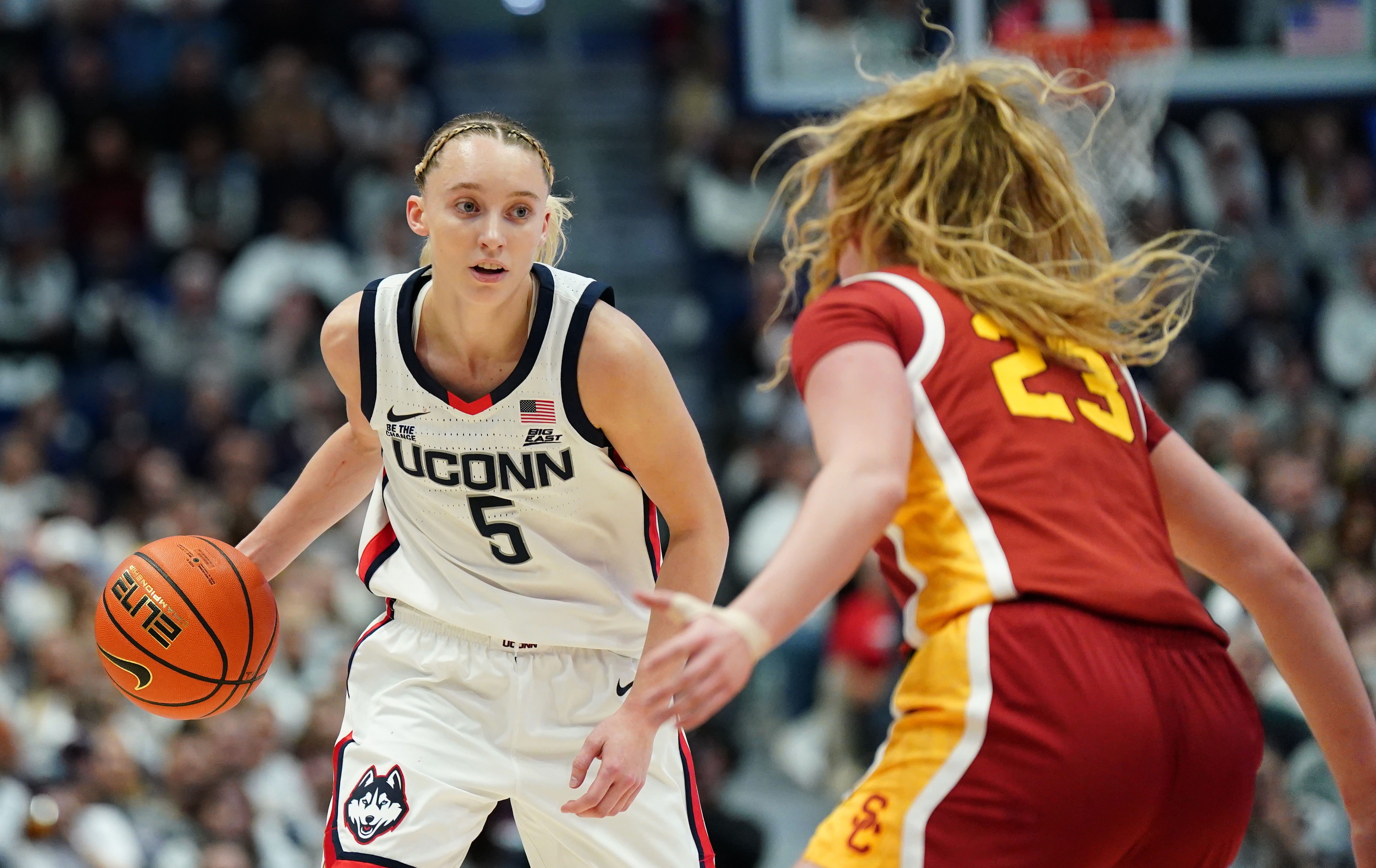 UConn Huskies guard Paige Bueckers moves the ball against USC Trojans guard Avery Howell in the first half of their NCAA basketball game at XL Center. Photo: Imagn