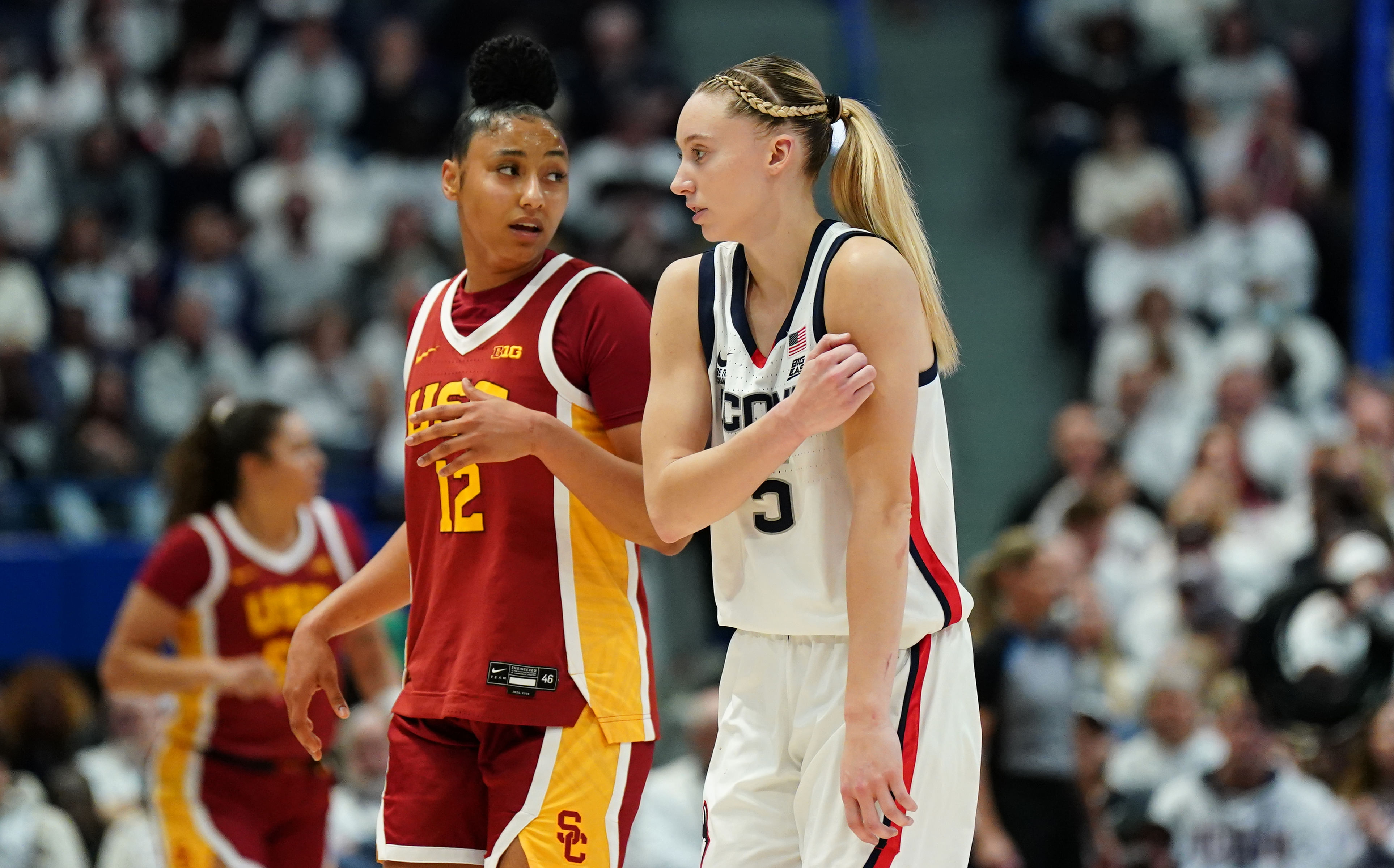 UConn Huskies guard Paige Bueckers (#5) and USC Trojans guard JuJu Watkins (#12) on the court in the first half of their NCAA basketball game at XL Center on Saturday, Dec. 21, 2024. Photo: Imagn