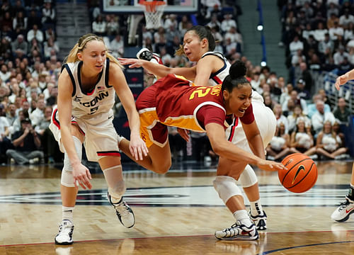 USC Trojans guard JuJu Watkins (#12) drives the ball against UConn Huskies guards Paige Bueckers (#5) and Kaitlyn Chen (#20) in the second half at XL Center. Photo: Imagn