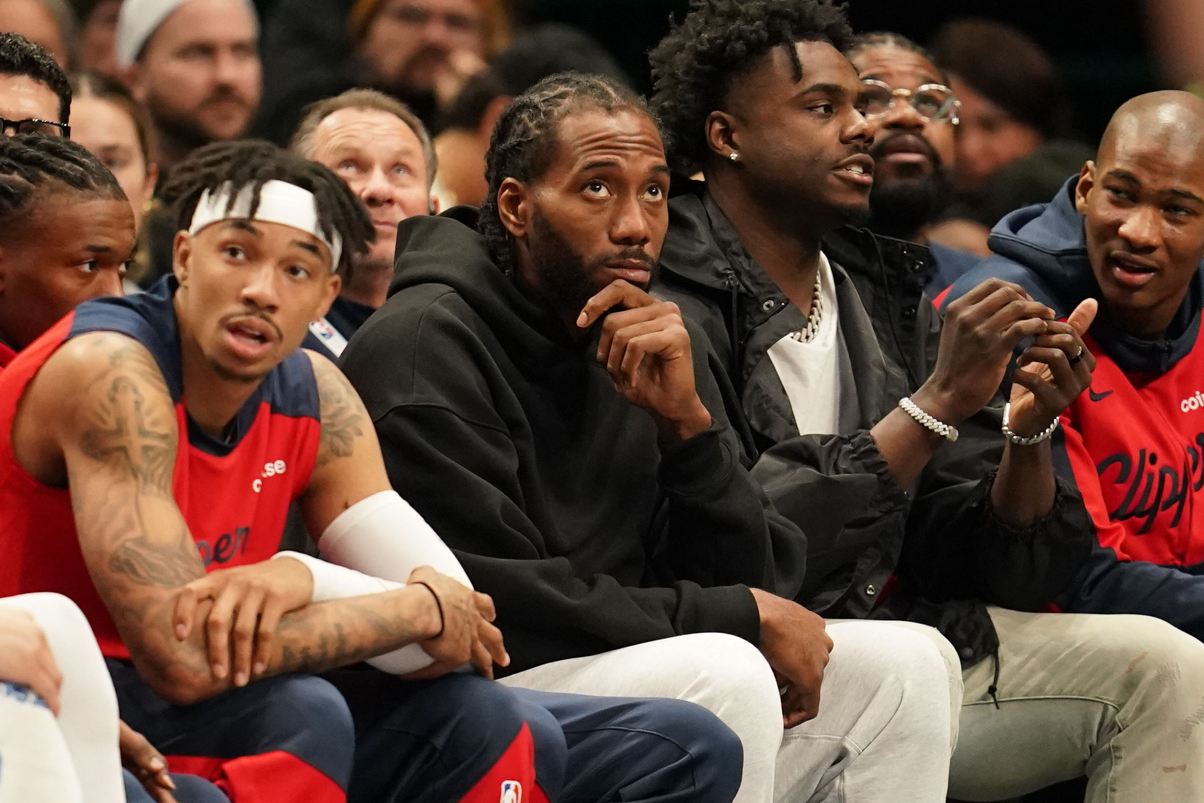 Kawhi Leonard looks on from the bench in street clothes during the game against the Dallas Mavericks during the second half at American Airlines Center. Mandatory Credit: Chris Jones-Imagn Images