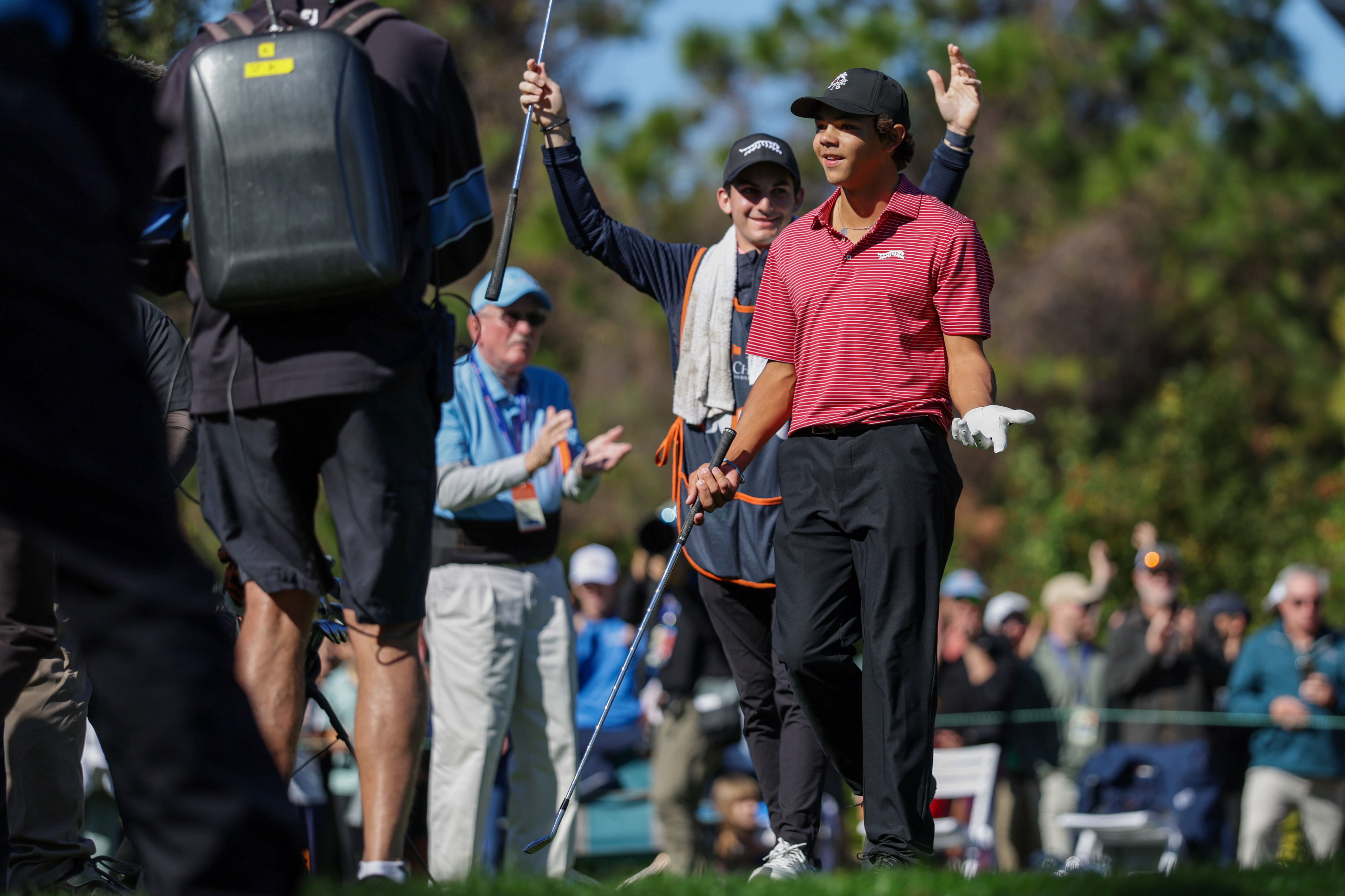 Charlie Woods hits a hole-in-one on the fourth hole during the PNC Championship at The Ritz-Carlton Golf Club (Image Source: Imagn)