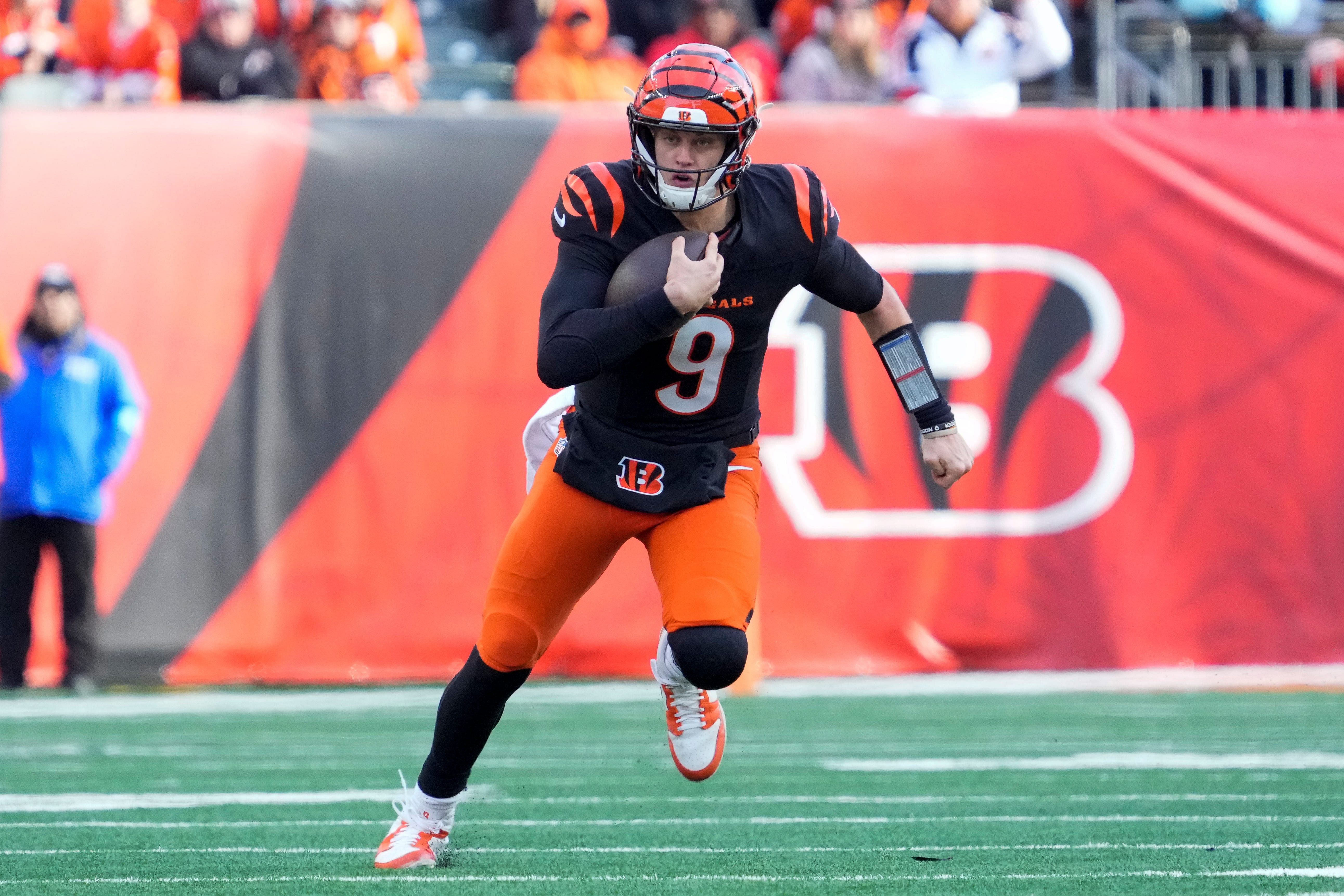 Cincinnati Bengals quarterback Joe Burrow (9) runs for a first down in the second quarter of the NFL Week 16 game between the Cincinnati Bengals and the Cleveland Browns. (Credits: IMAGN)