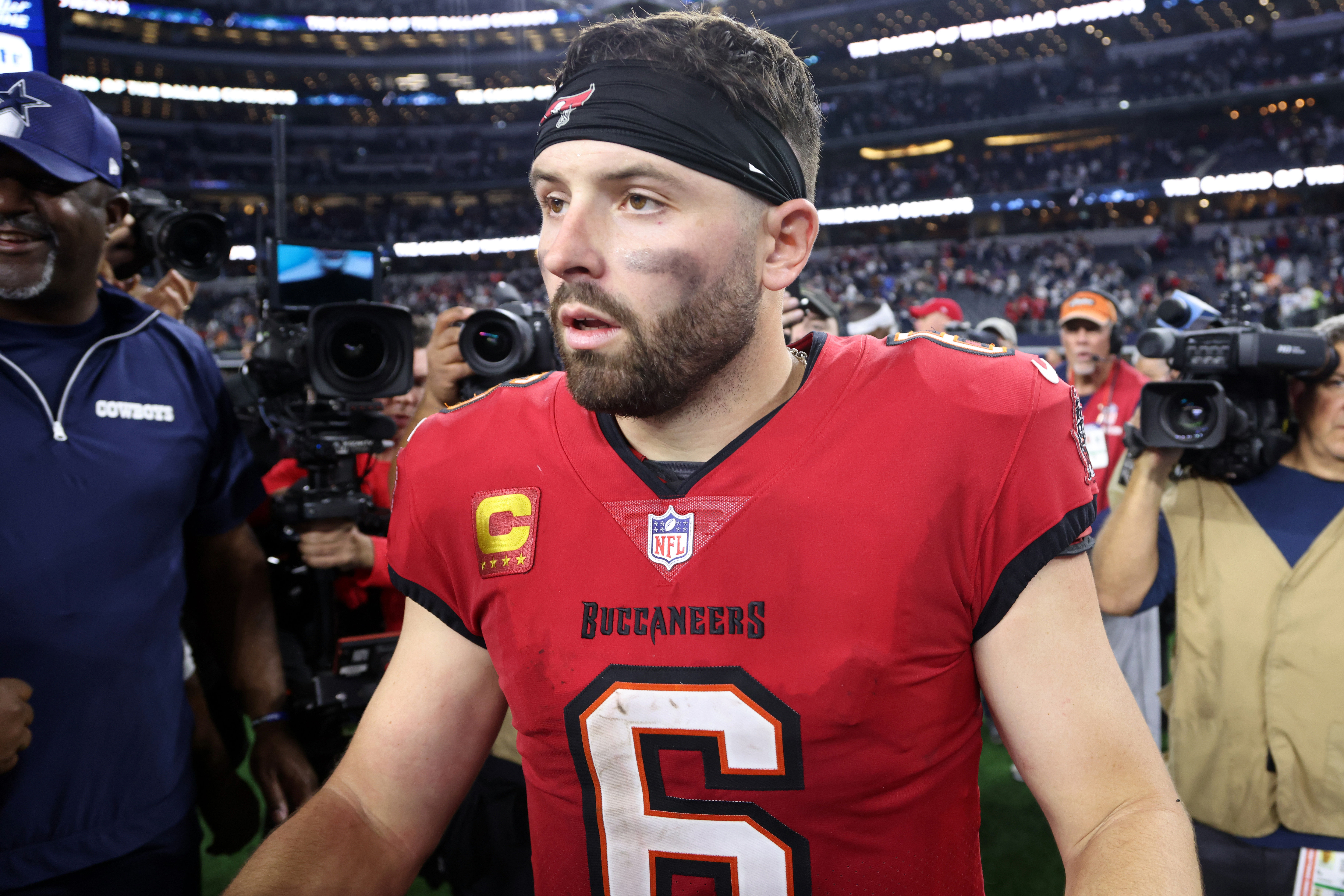 Buccaneers quarterback Baker Mayfield walks off the field after the game against the Cowboys - Source: Imagn