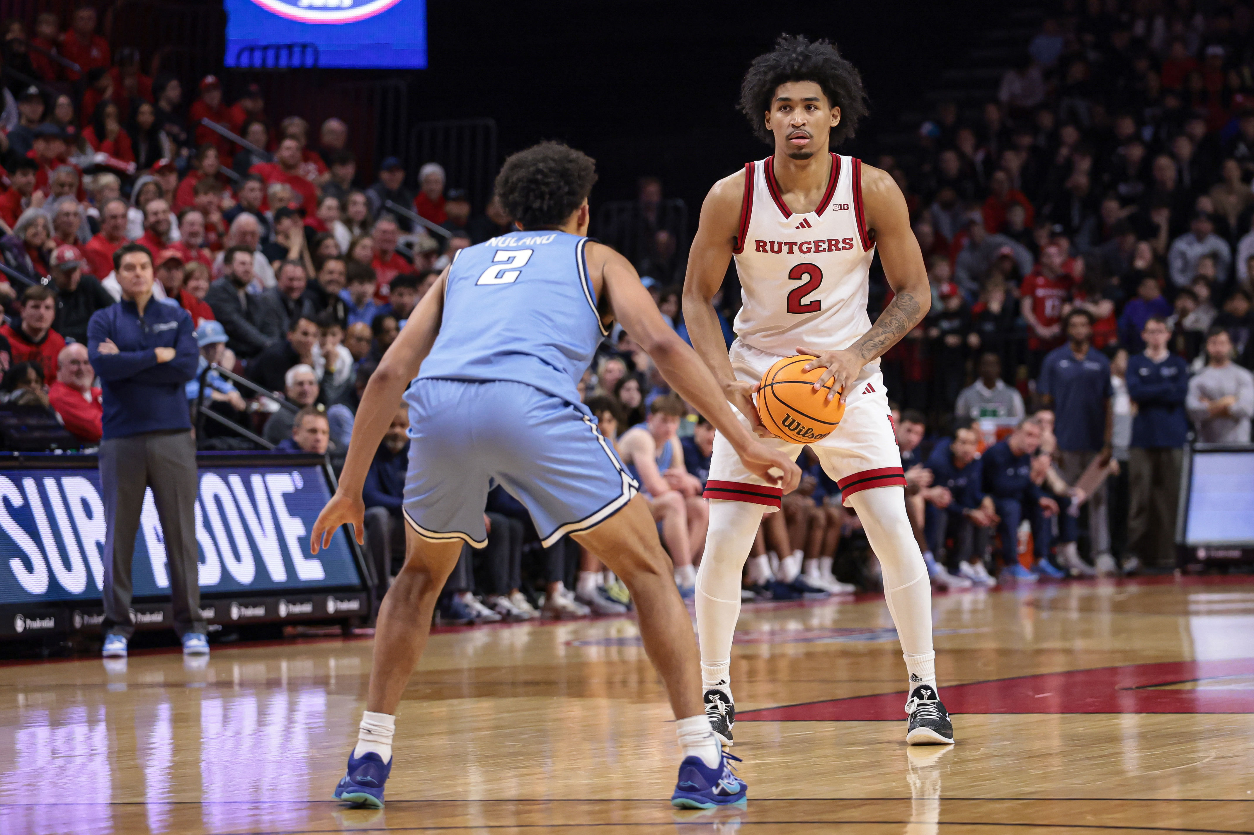 Rutgers Scarlet Knights guard Dylan Harper (#2) looks to attack the defense of Columbia Lions guard Kenny Noland (#2) at Jersey Mike&#039;s Arena. Photo: Imagn