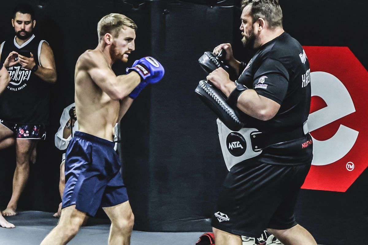 Jonathan Haggerty (left) putting in the work alongside longtime coach Christian Knowles.