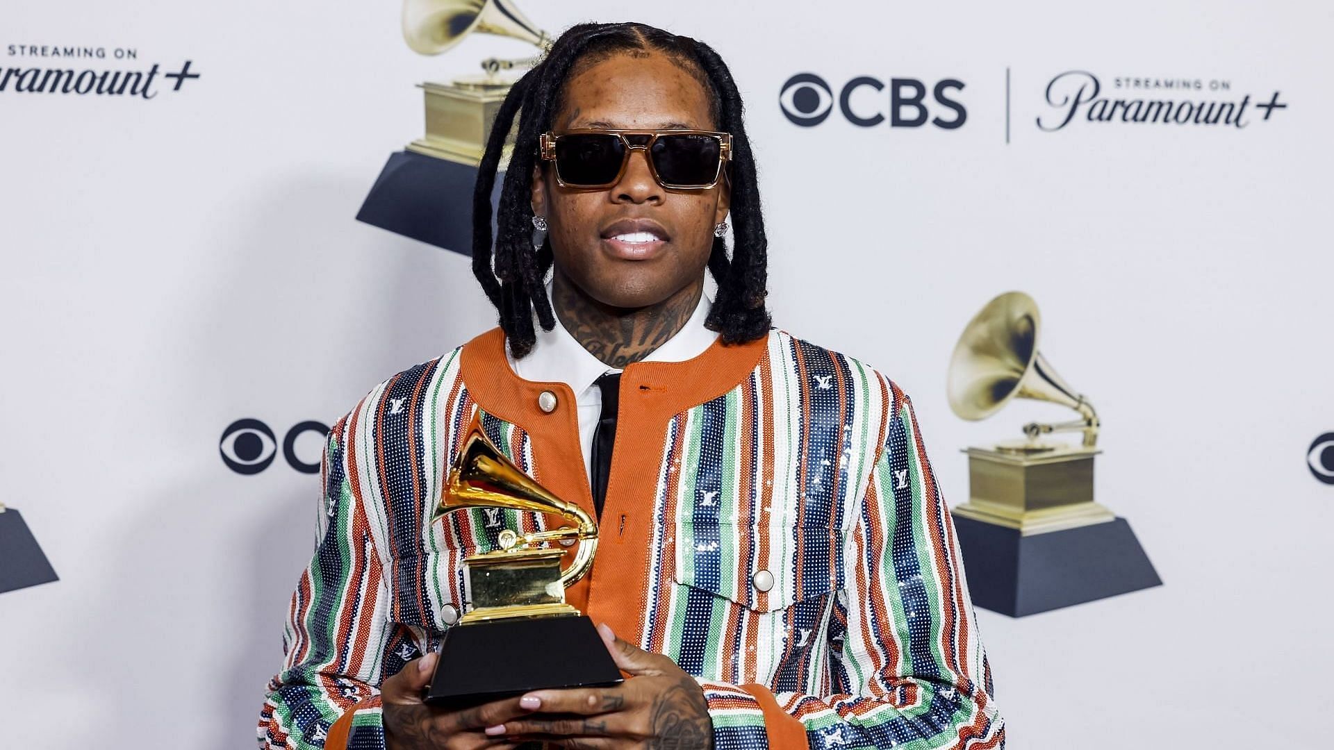 Winner Lil Durk posing with a trophy for &quot;All My Life,&quot; at the 66th Grammy Awards on February 4, 2024. (Image via Getty/Jason Armond)