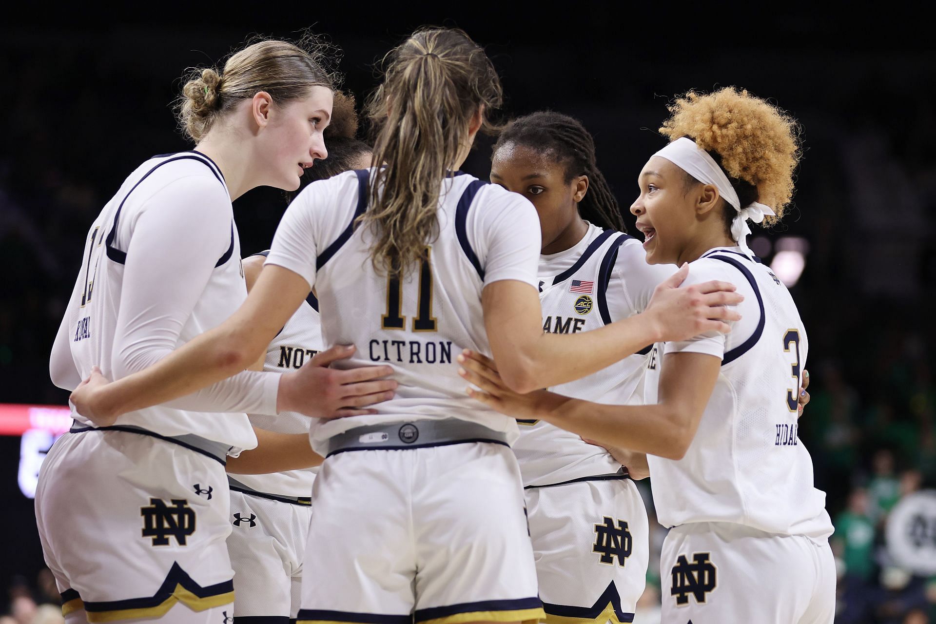 Hannah Hidalgo (#3) of the Notre Dame Fighting Irish huddles with Kate Koval (#13), Sonia Citron (#11), Olivia Miles (#5) and Liatu King (#20) in the game against the Texas Longhorns. Photo: Getty