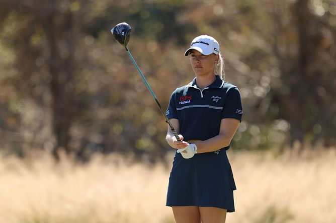 Charley Hull helps young golfer as she takes her to practice