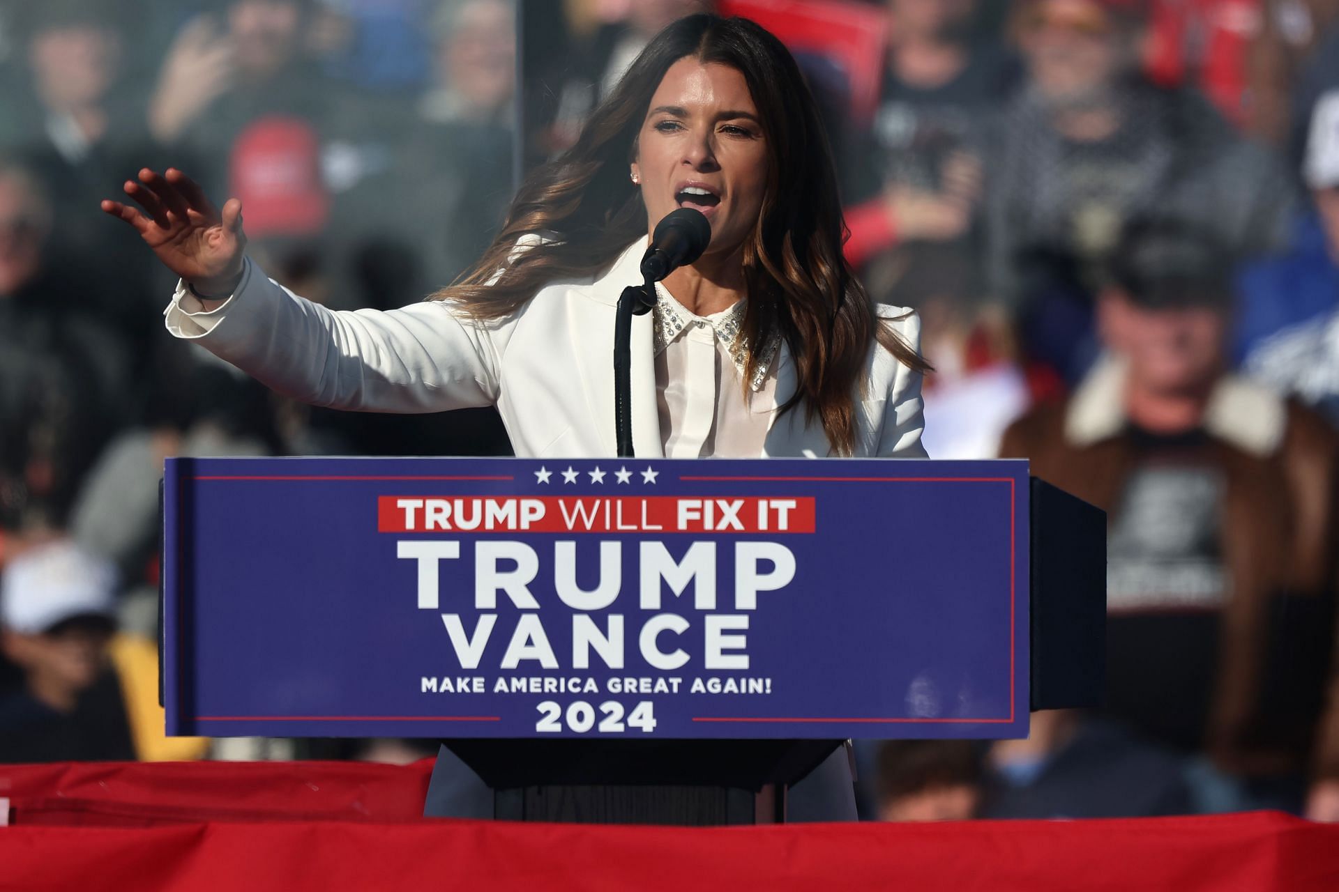 Former NASCAR driver Danica Patrick speaks during a Republican presidential nominee, former U.S. President Donald Trump campaign rally - Source: Getty Images