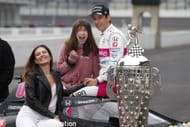 Helio Castroneves poses with his wife and daughter after his 4th Indy 500 win in 2021 - Source: Getty