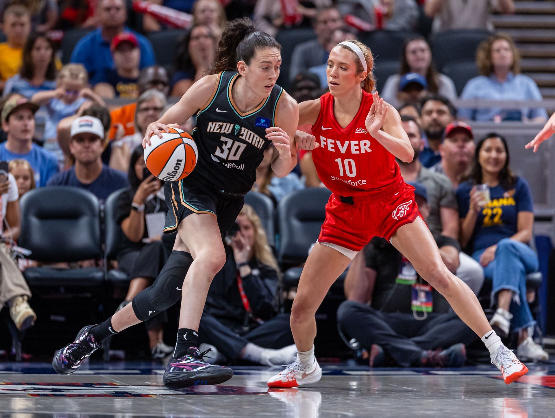 Lexie Hull of the Indiana Fever tries to defend against a New York Liberty player. (Credits: Getty)