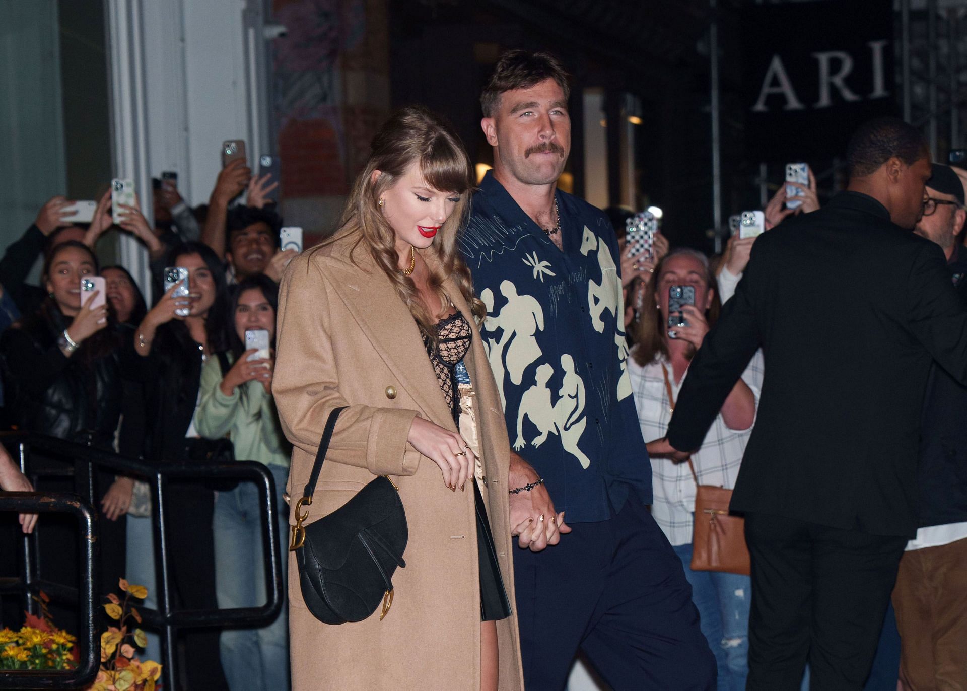 NFL power couple Travis Kelce and Taylor Swift were spotted at an event in October. (Credits: Getty)