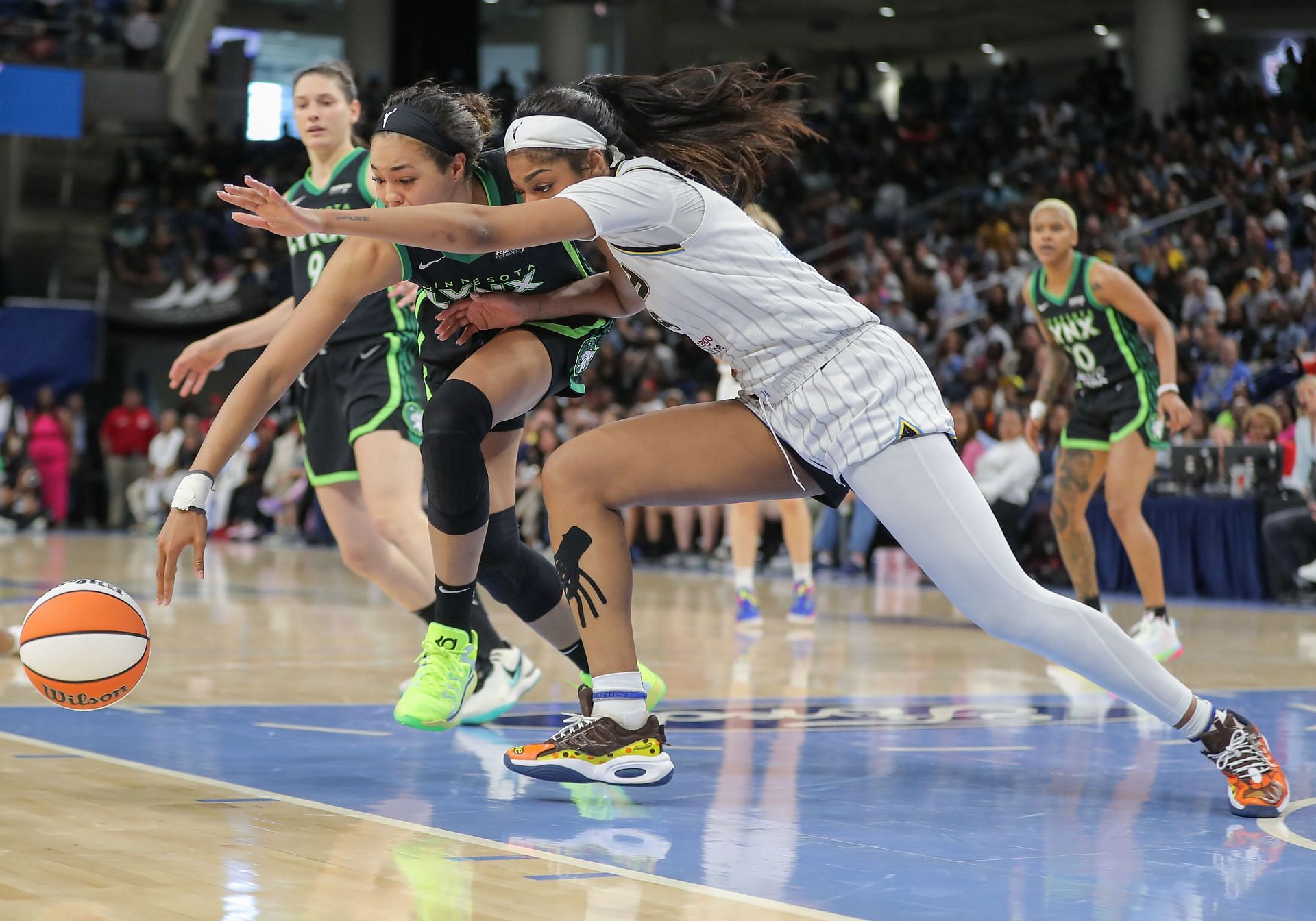 Collier #24 of the Minnesota Lynx and Reese #5 of the Chicago Sky reach for a loose ball during the second half on June 30, 2024 at Wintrust Arena in Chicago, Illinois -  Source: Getty