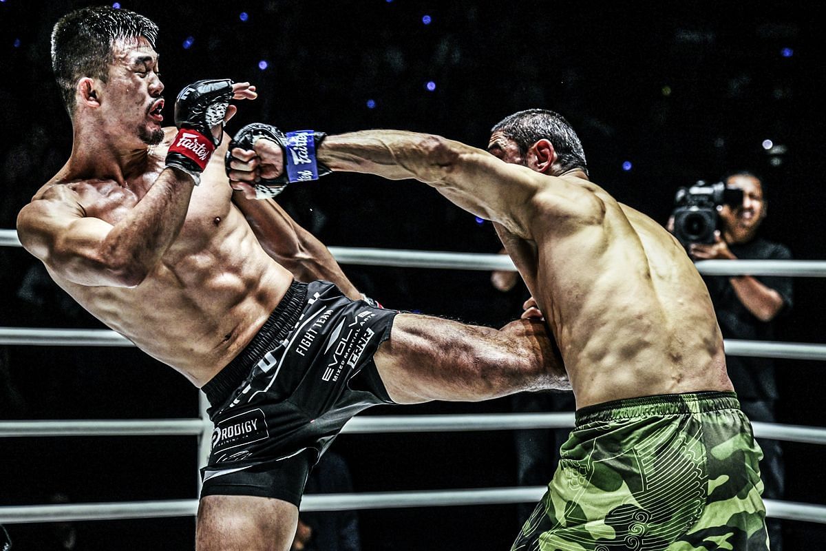 (From left) Christian Lee and Alibeg Rasulov trading strikes in Bangkok.