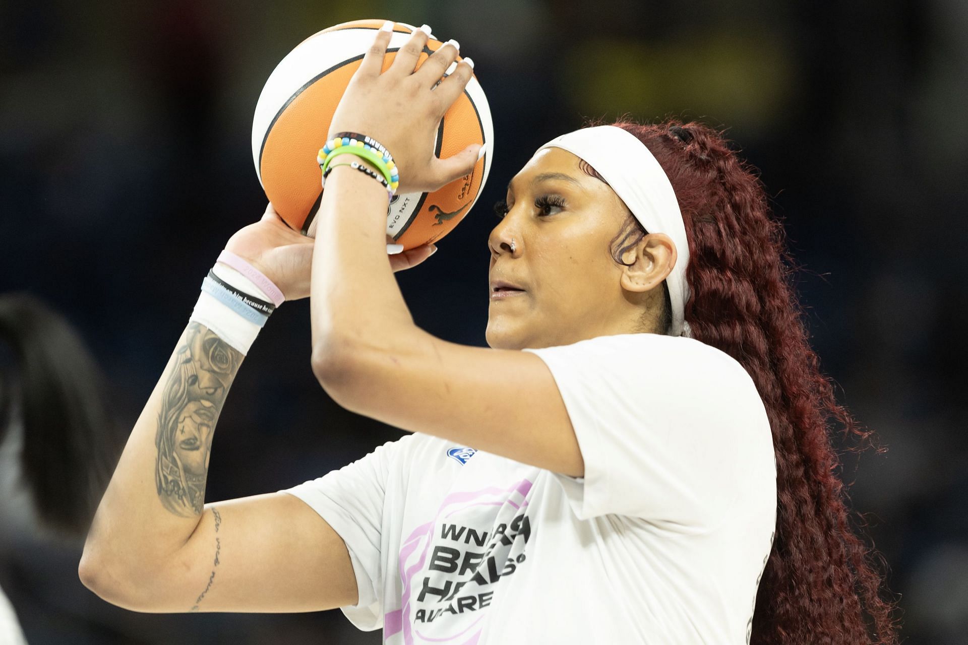 A Chicago Sky player takes warm-up shots before a home basketball game (Credits: Getty)