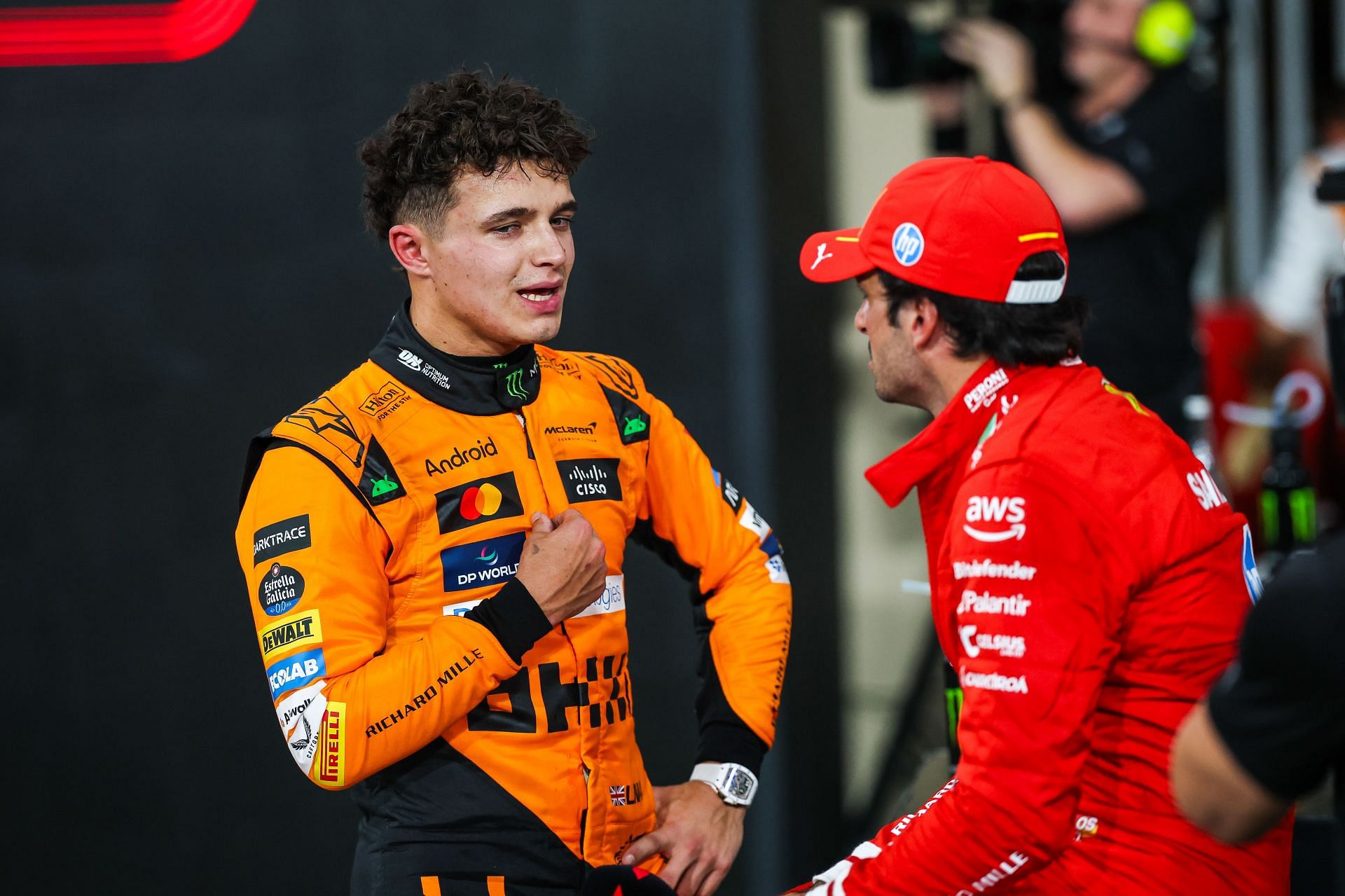 Lando Norris of Great Britain and McLaren with Carlos Sainz of Spain and Ferrari at Abu Dhabi GP- Source: Getty