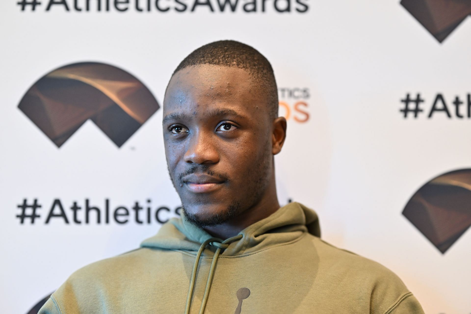 Letsile Tebogo donning an Olive hoody during the press conference before the 2024 World Athletics Awards in Monaco (Image via: Getty Images)