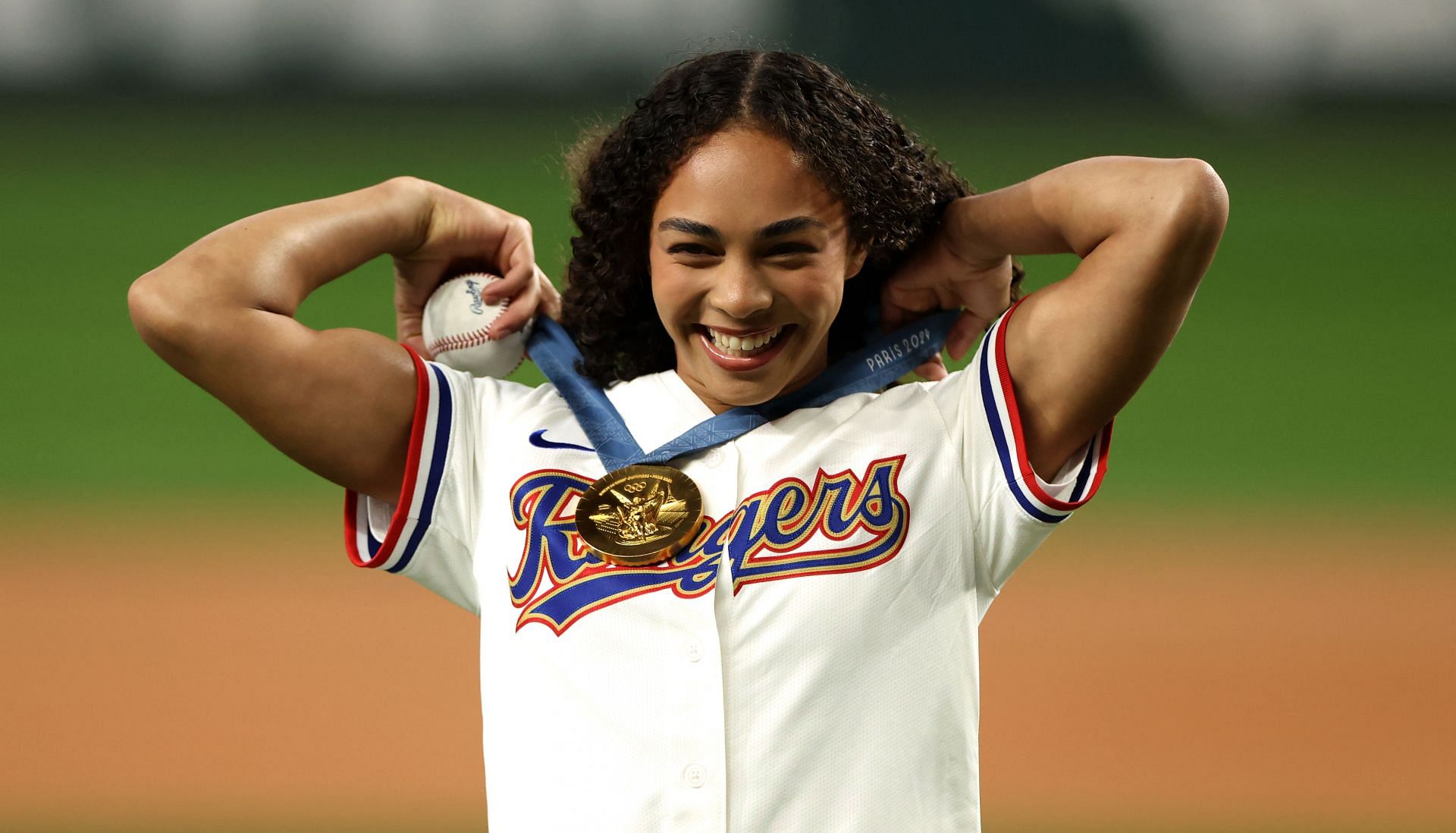 Hezly Rivera throwing the first pitch between the Texas Rangers and the New York Yankees in Texas. (Photo: Getty Images)