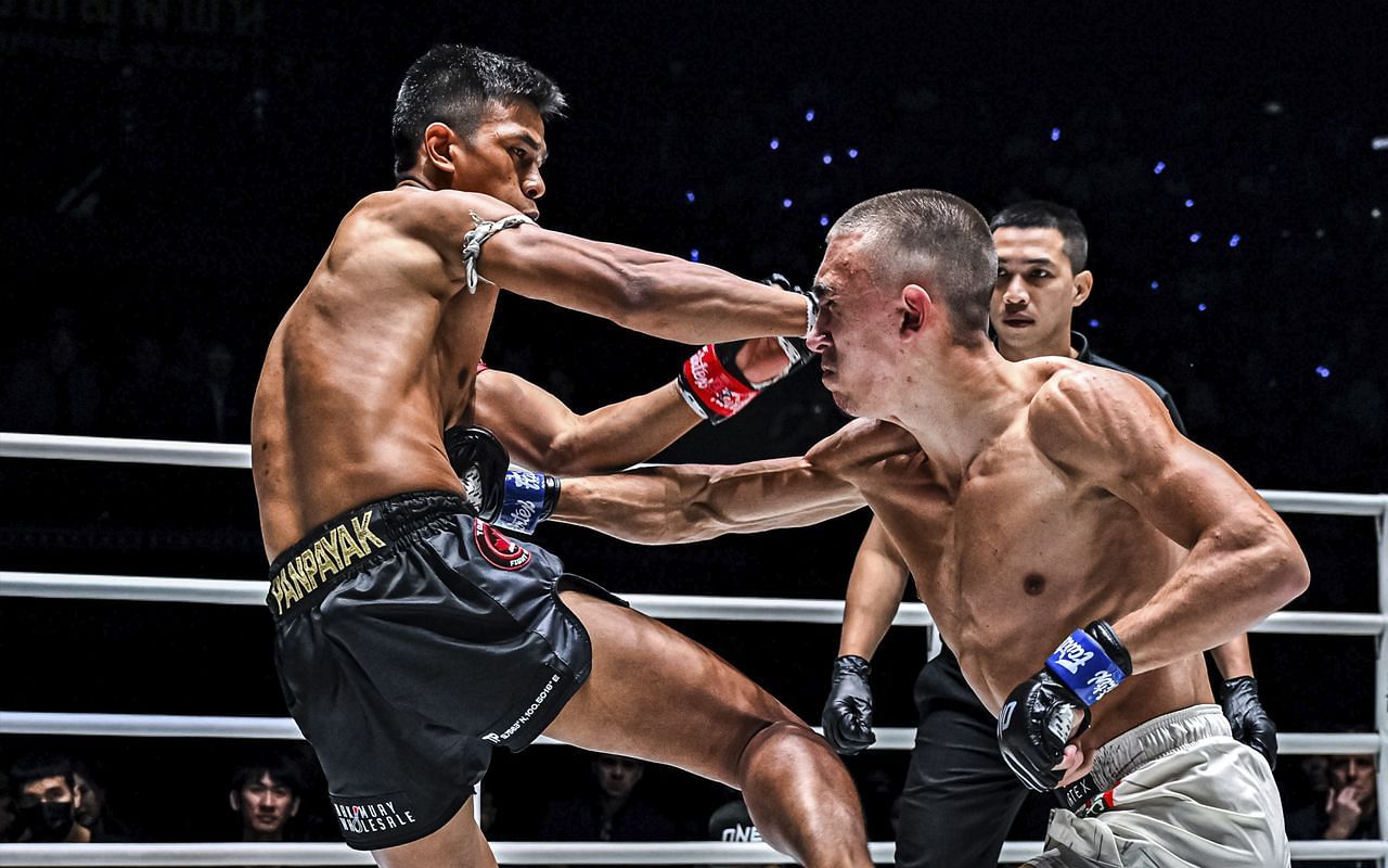 Egor Bikrev (right) lands a punch against Panpayak Jitmuangnon (right). [Photo from ONE Championship]